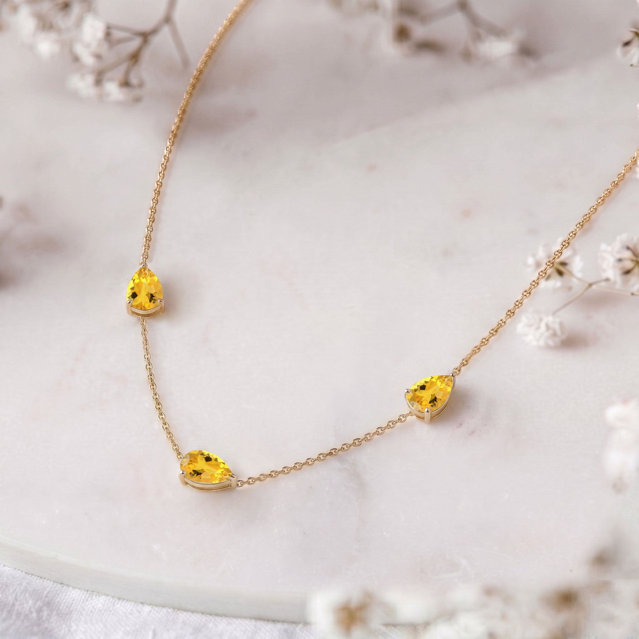 Close up of genuine Citrine pear cut gemstones
