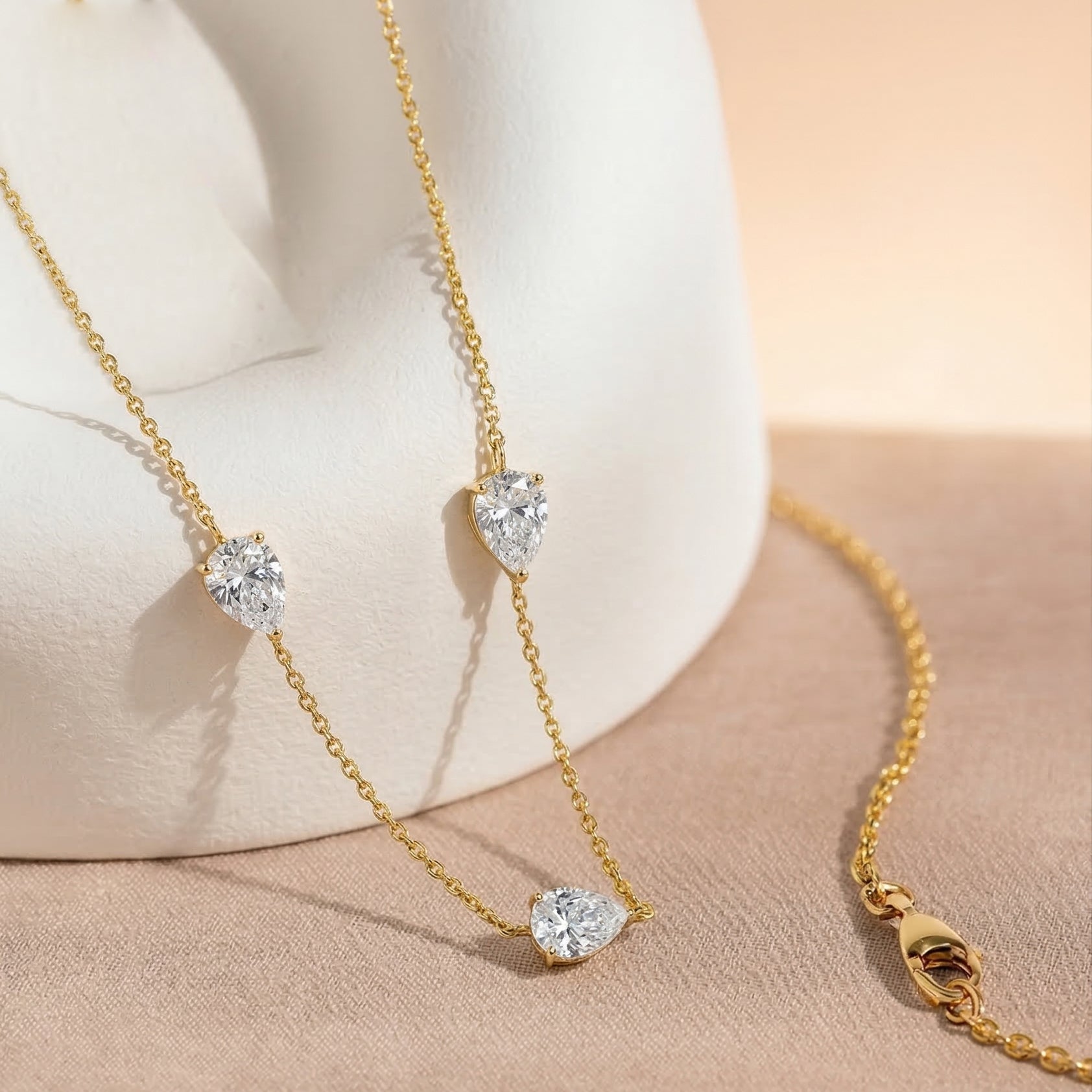 Yellow gold filled Moissanite necklace with three pear cut stones
