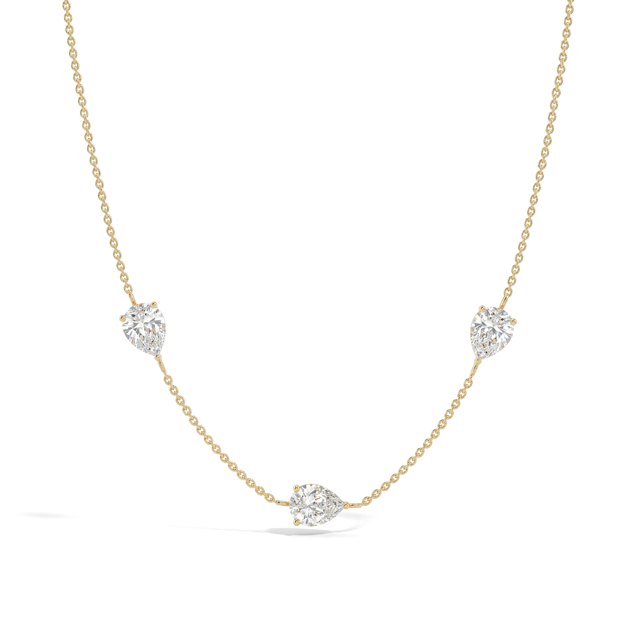 Moissanite three stone necklace in 925 sterling silver with yellow gold filled finish featuring three pear cut gemstones.
