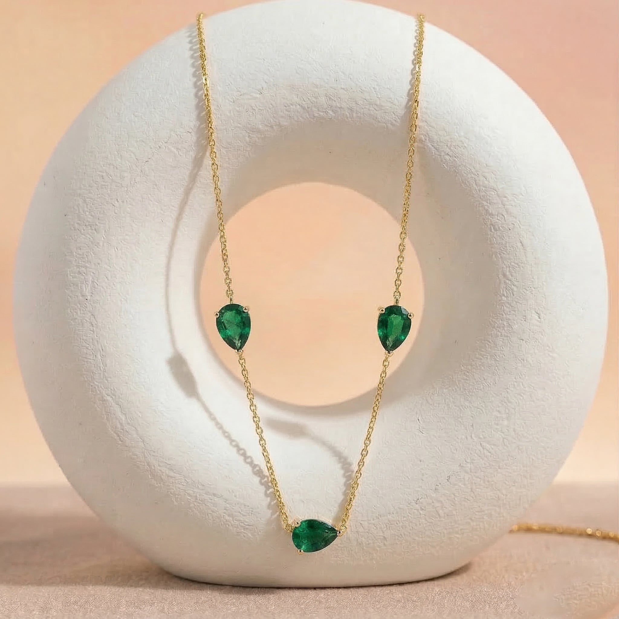 Close up of genuine Emerald pear cut gemstones
