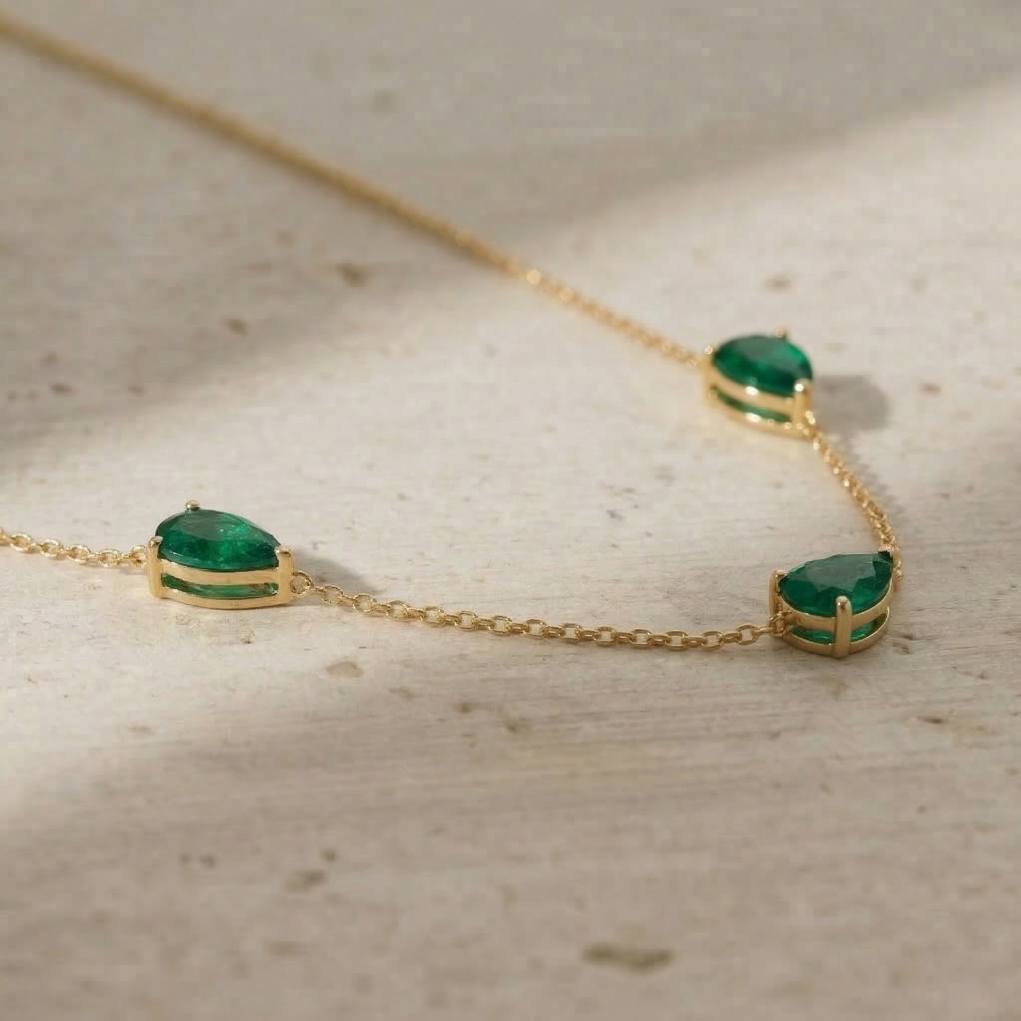Minimalist Emerald three stone necklace for everyday wear
