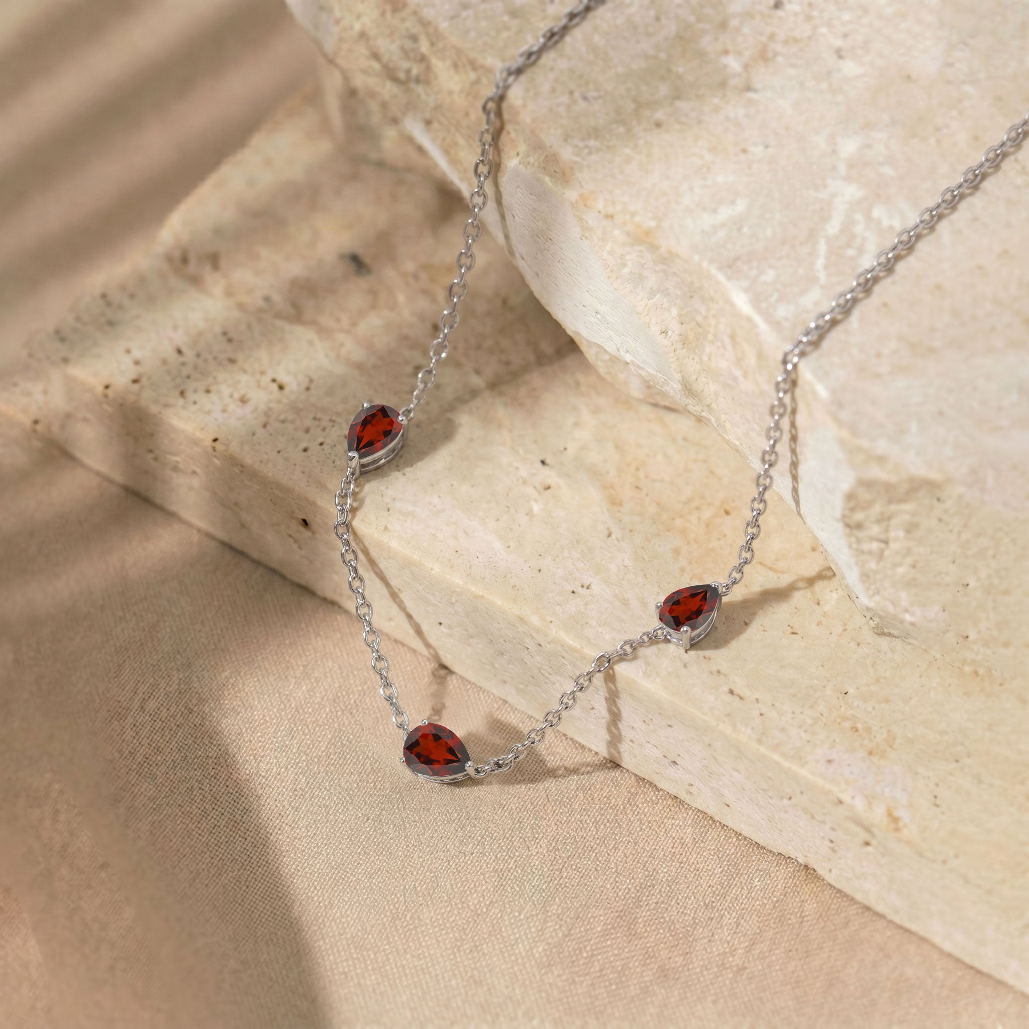Luxury Garnet necklace with three stone design
