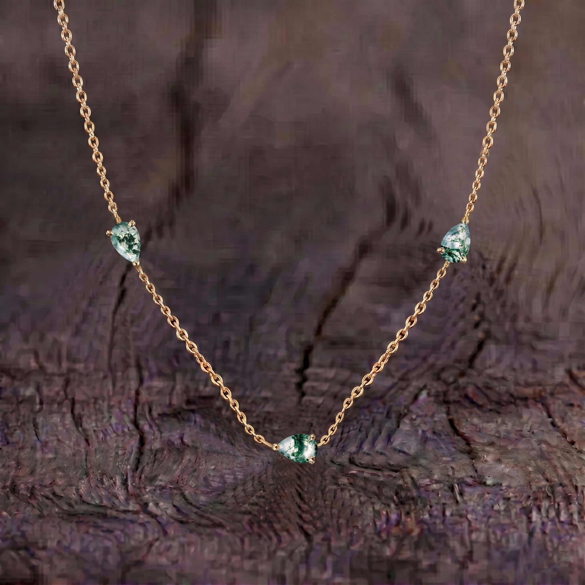 Close up of genuine Moss Agate pear cut gemstones
