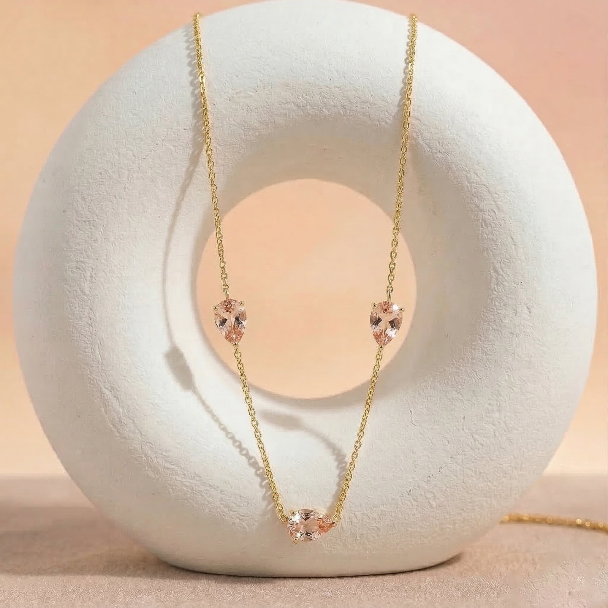 Yellow gold filled Morganite necklace with three pear cut stones

