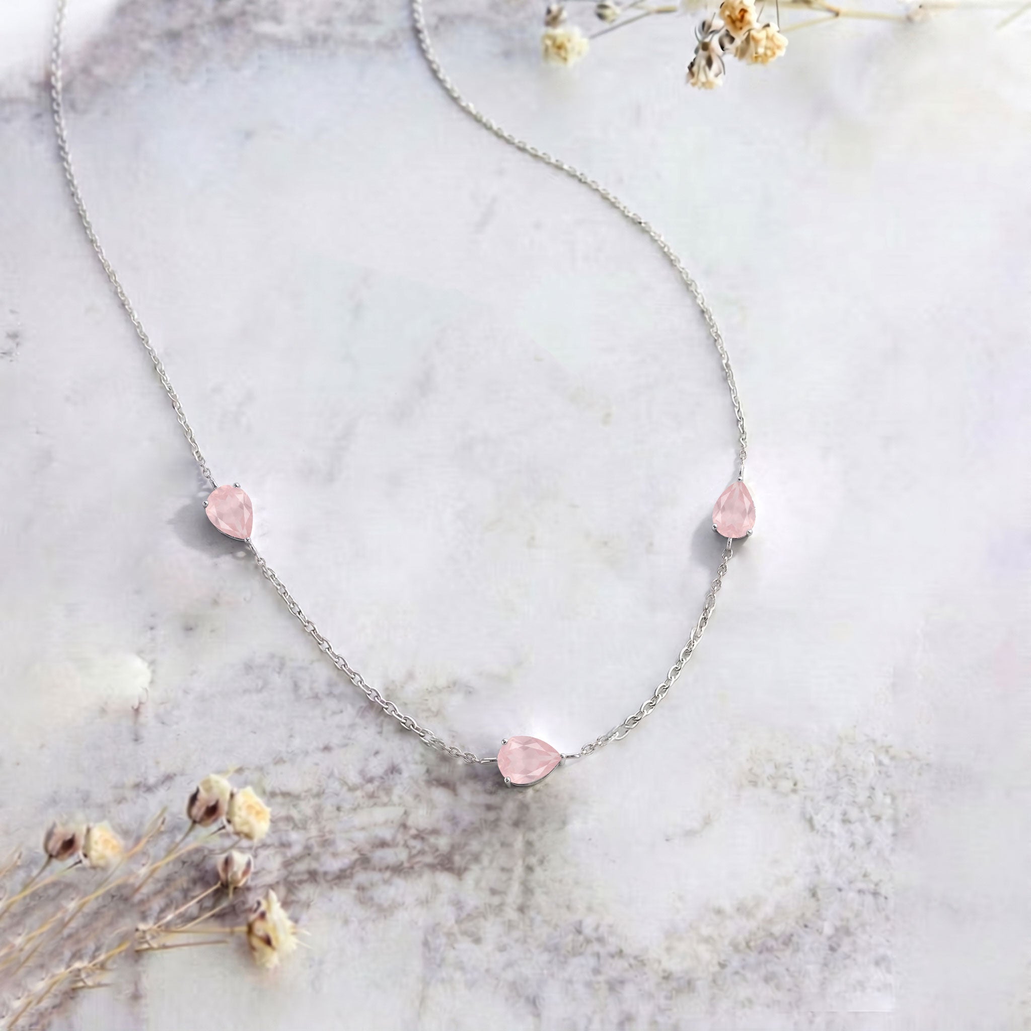 Delicate rose quartz gemstone necklace in sterling silver with yellow gold filled finish and extender chain.
