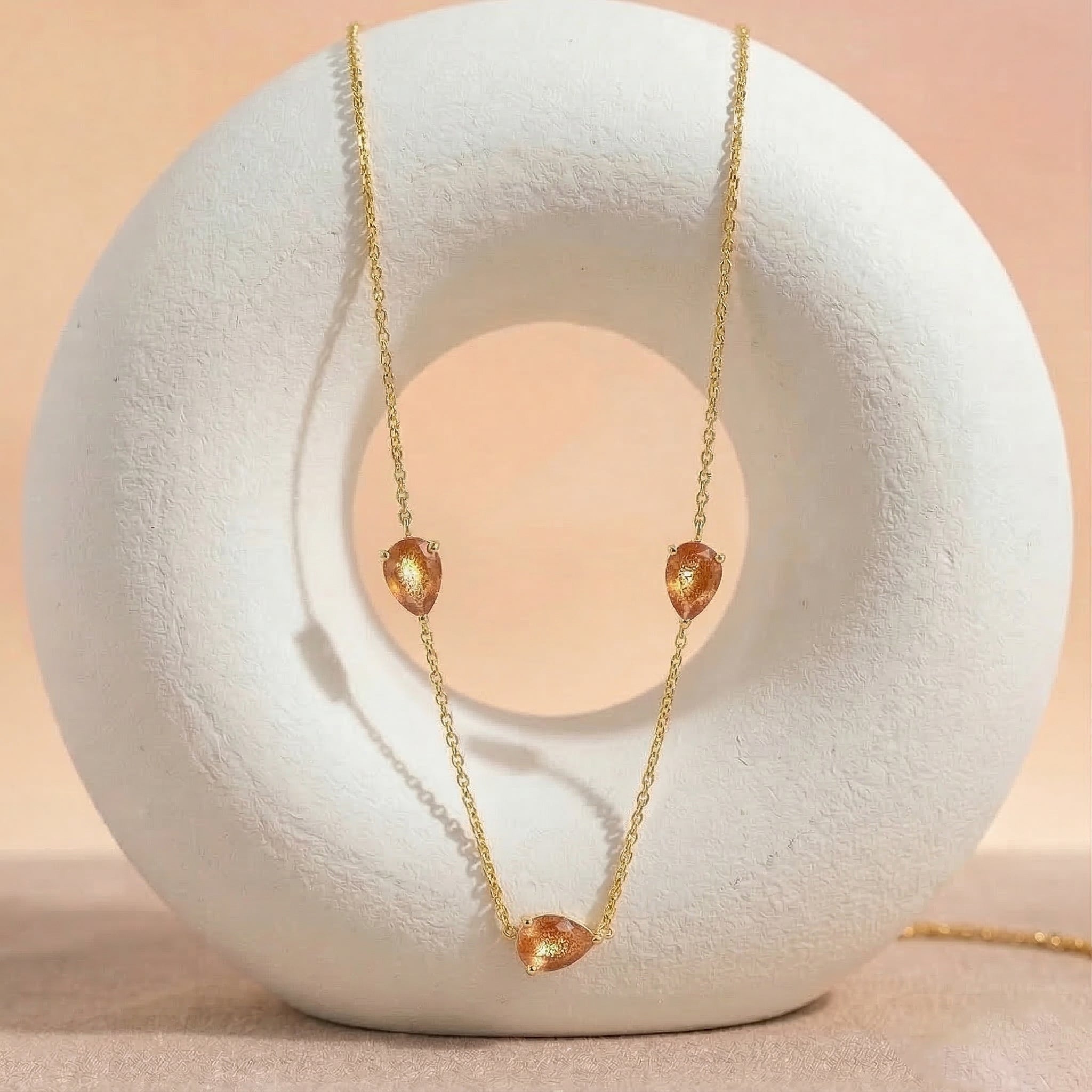 Luxury Sunstone pendant necklace with warm orange and golden gemstone sparkle design
