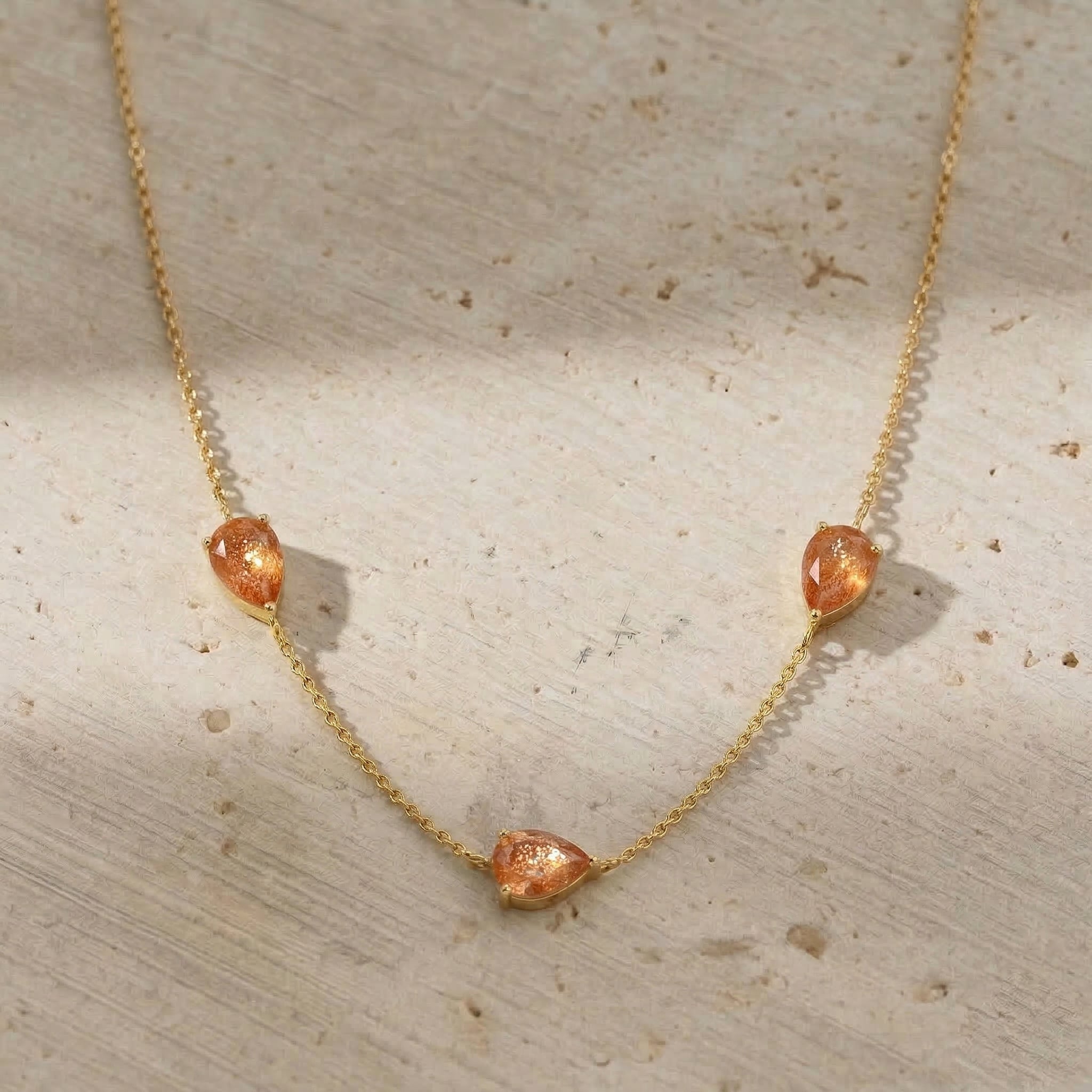 Fine jewelry Sunstone necklace with three gemstone accents and sophisticated feminine design

