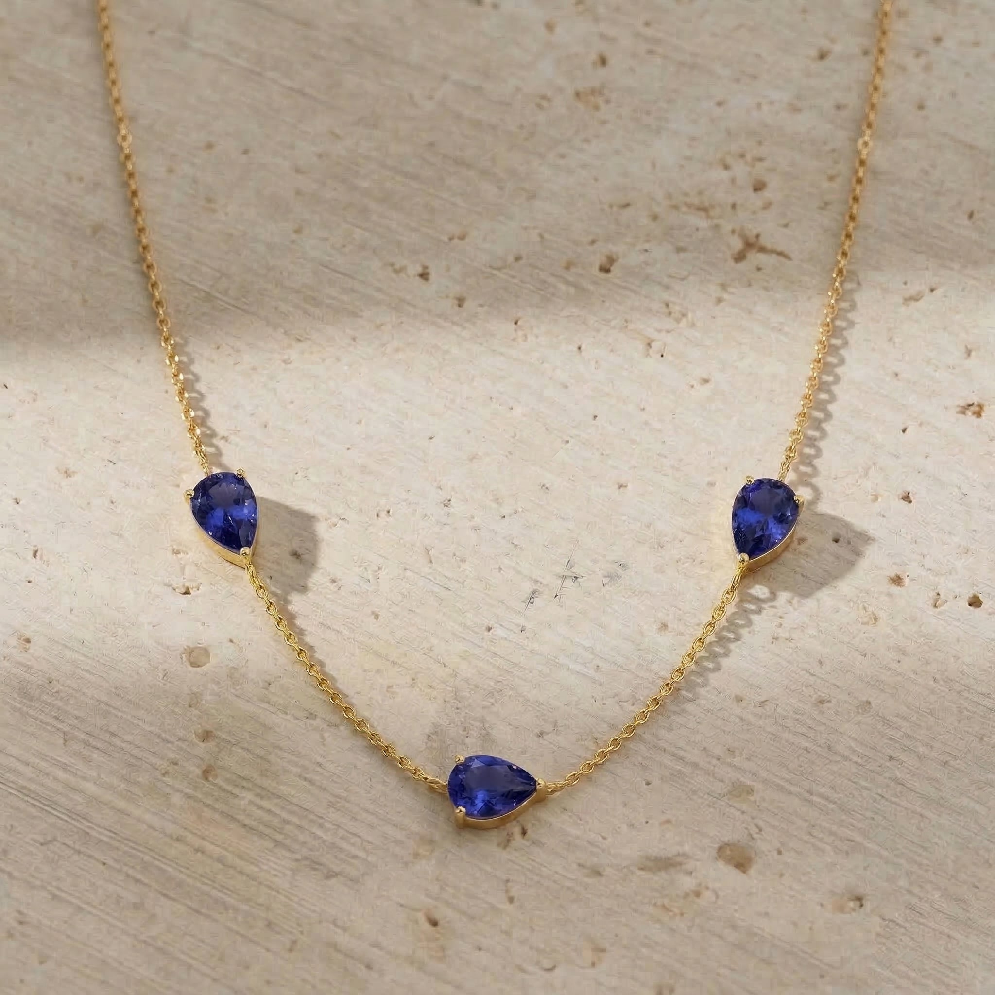 Premium Tanzanite birthstone necklace for women with pear cut gemstones and sophisticated pendant design
