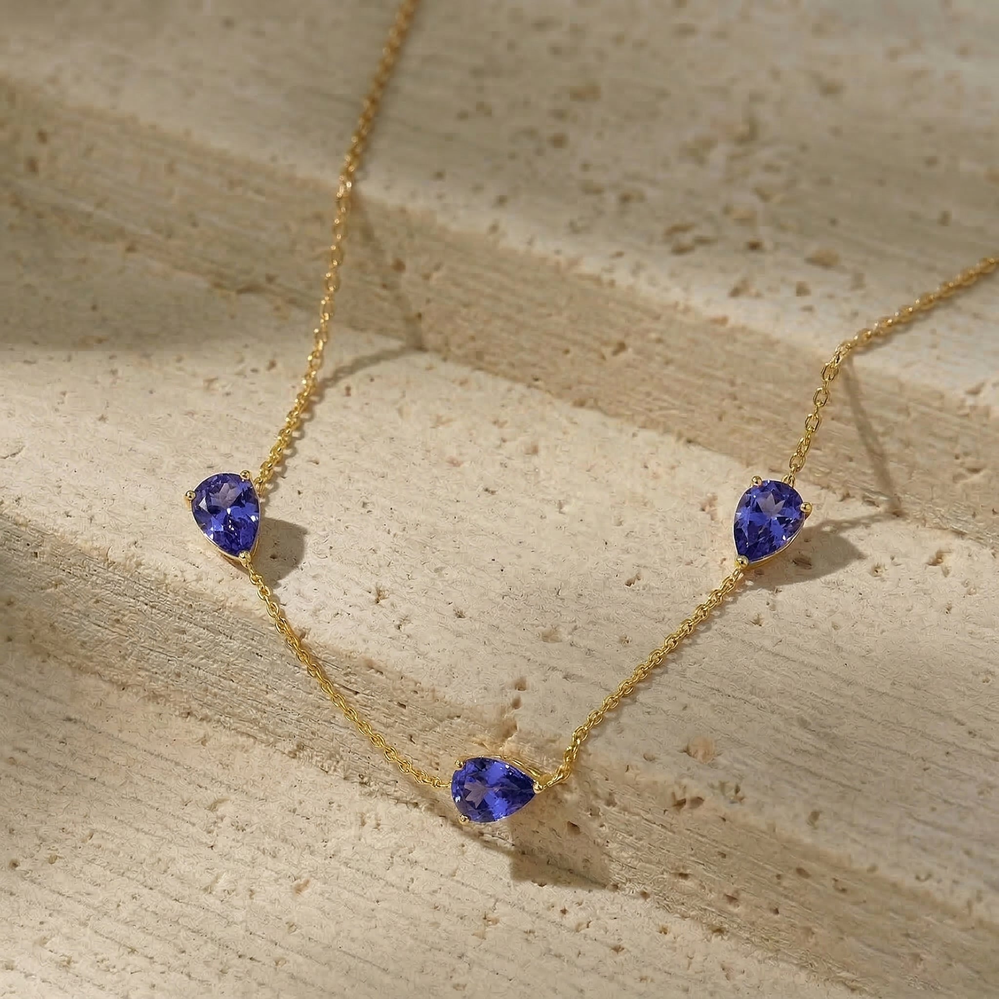 Romantic Tanzanite anniversary gift necklace featuring blue purple gemstones and sterling silver setting

