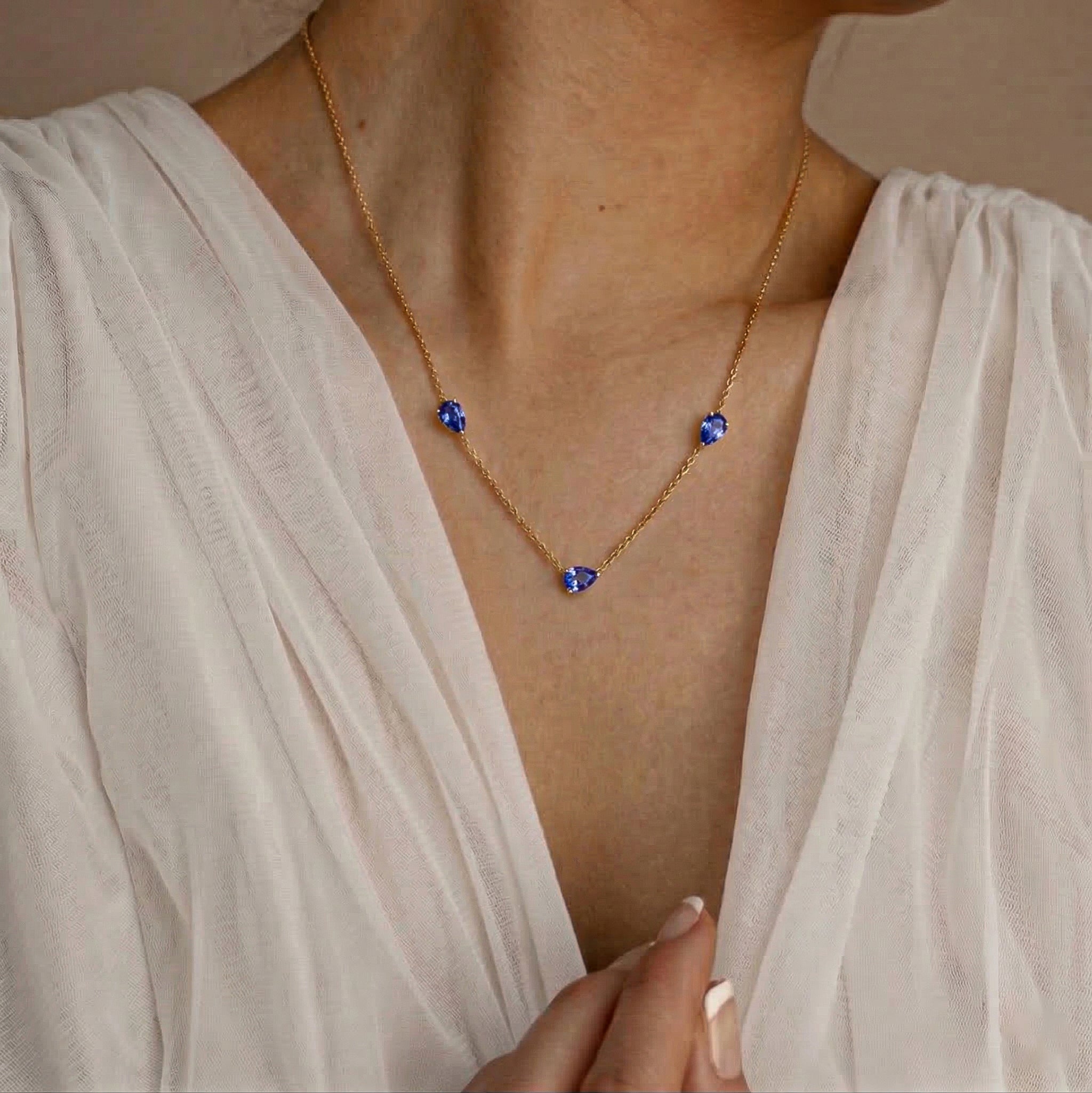 Natural Tanzanite layering necklace featuring three gemstone accents and delicate fine jewelry craftsmanship
