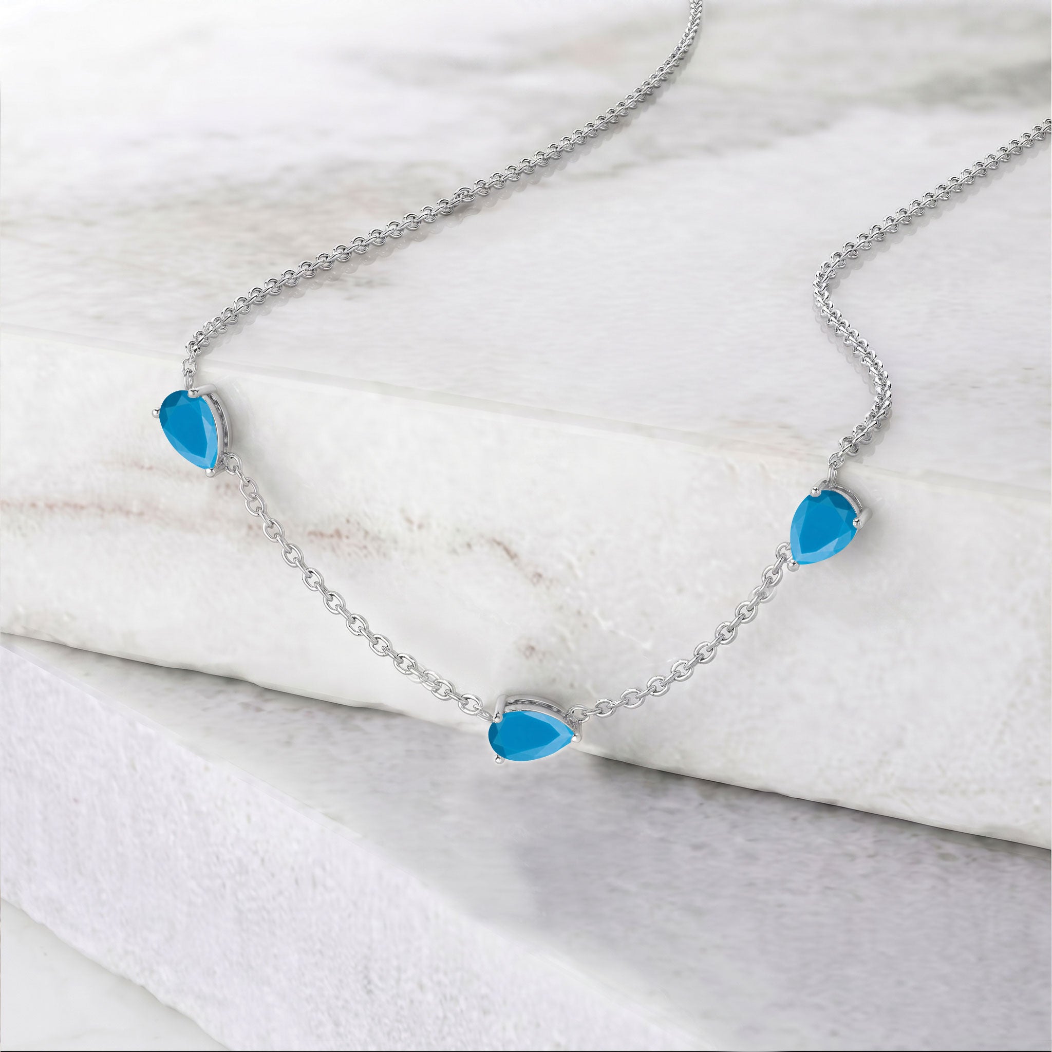 Natural turquoise pendant necklace with beautiful blue gemstone details and elegant sterling silver chain design
