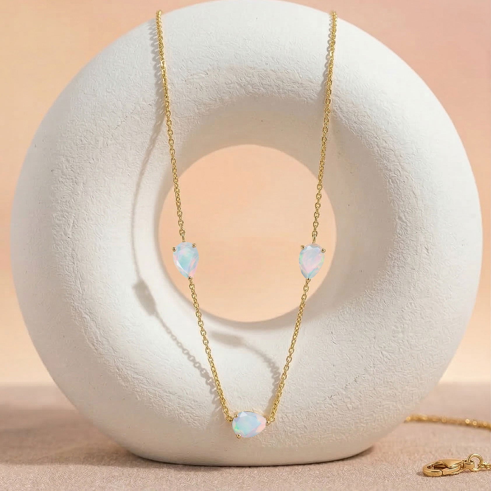 Premium white opal birthstone necklace with pear cut gemstones and sophisticated jewelry setting
