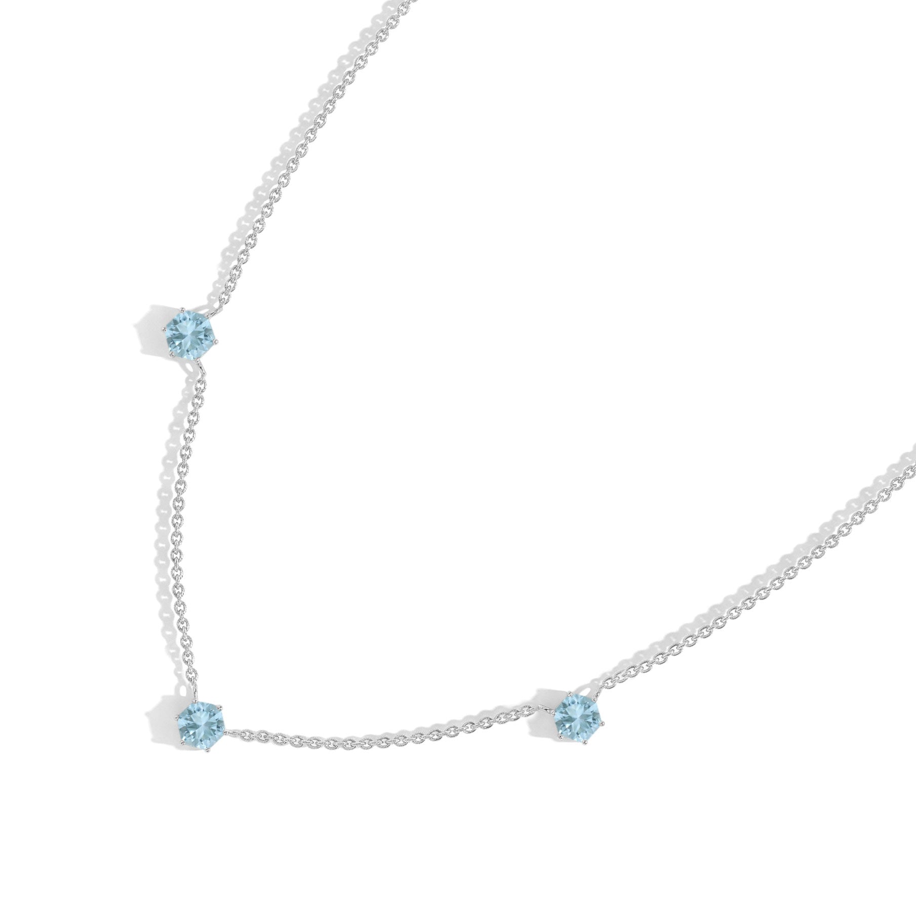 Hexagon-cut Aquamarine gemstone jewelry necklace featuring three gemstone stations with a delicate and luxurious finish.
