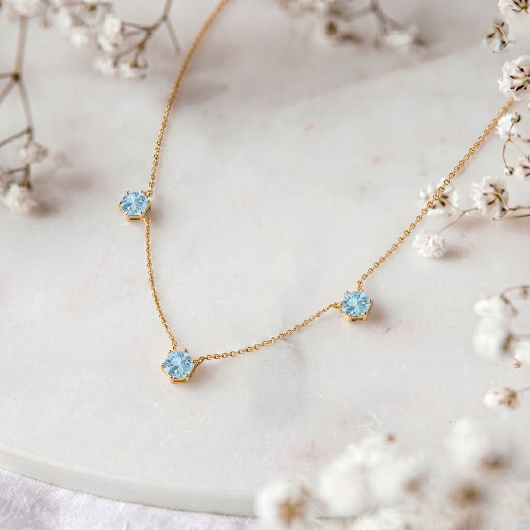 Adjustable Aquamarine station necklace for women featuring a 16 inch chain with extender and elegant gemstone detailing.
