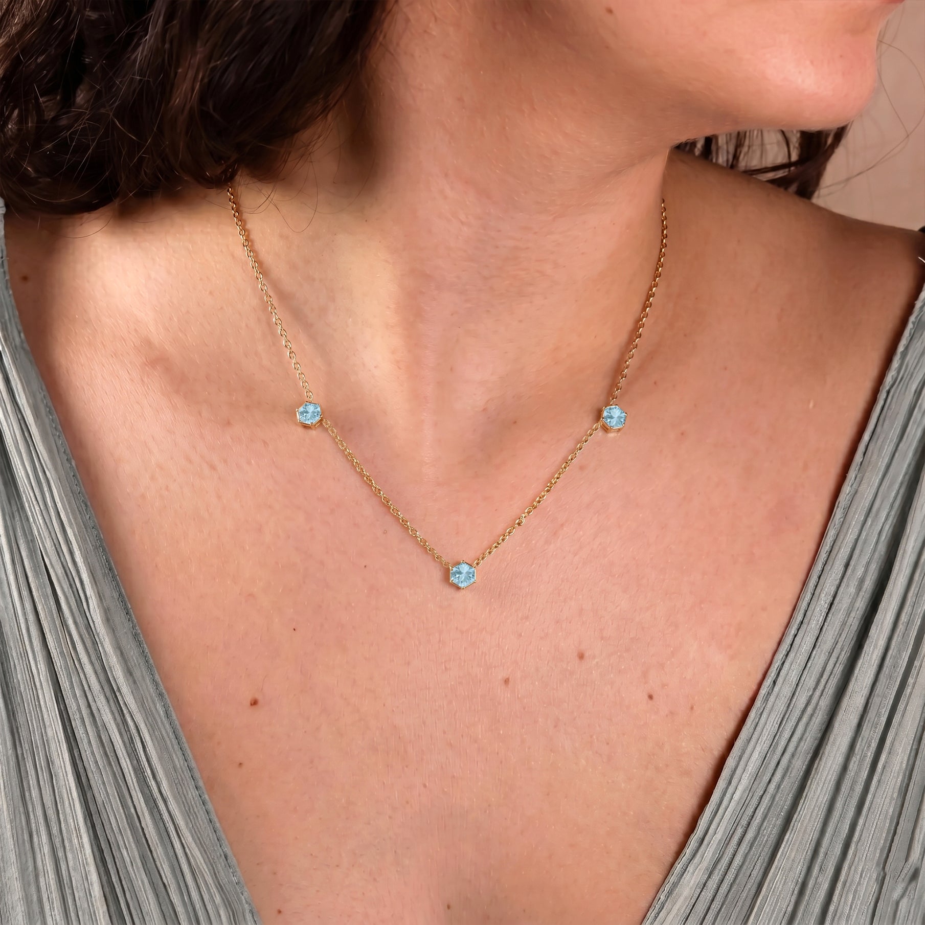 Fine jewelry Aquamarine necklace for everyday wear featuring hexagon-cut gemstones and a sophisticated minimalist station style.
