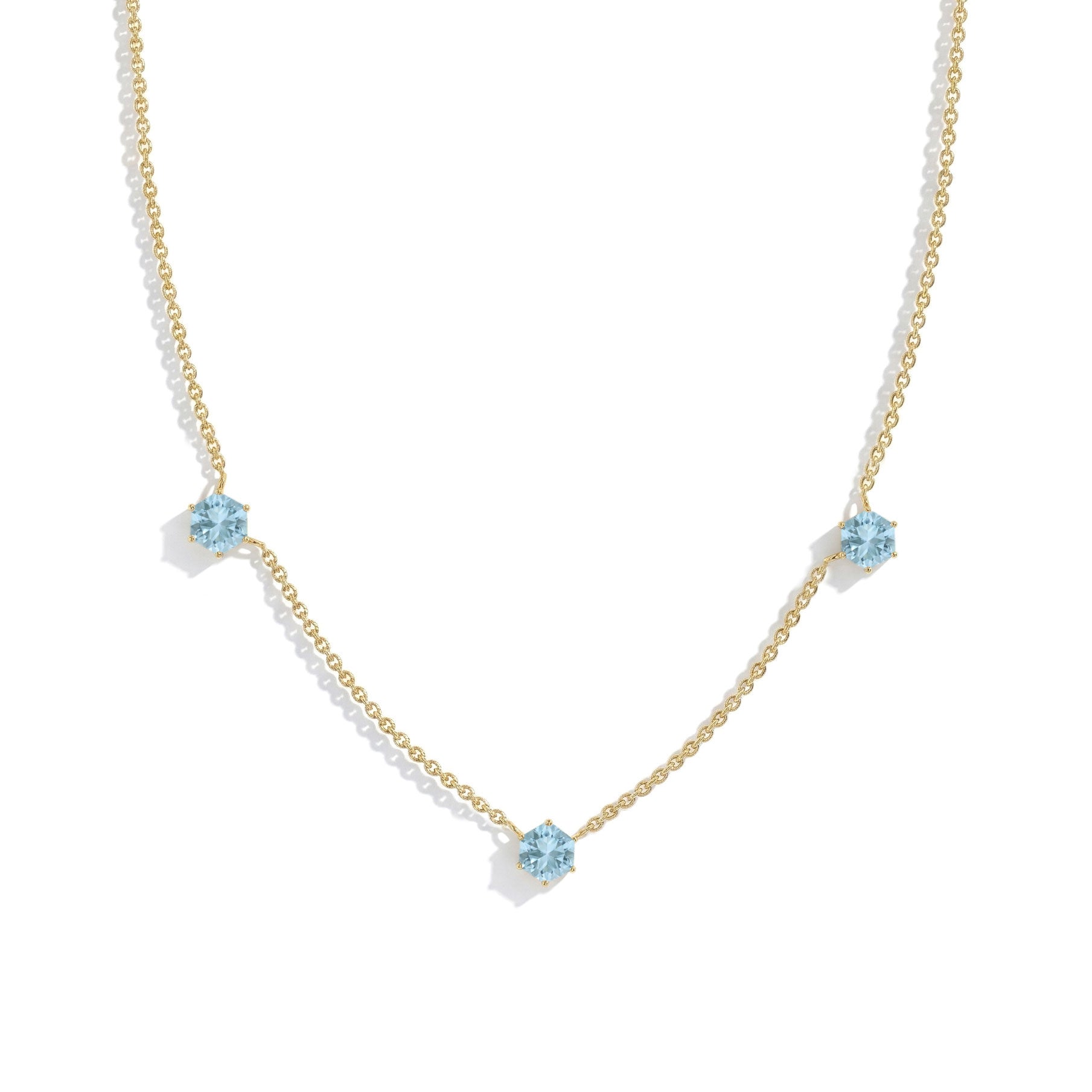 Aquamarine necklace with gold filled option featuring three hexagon-cut gemstones and an elegant fine jewelry design.
