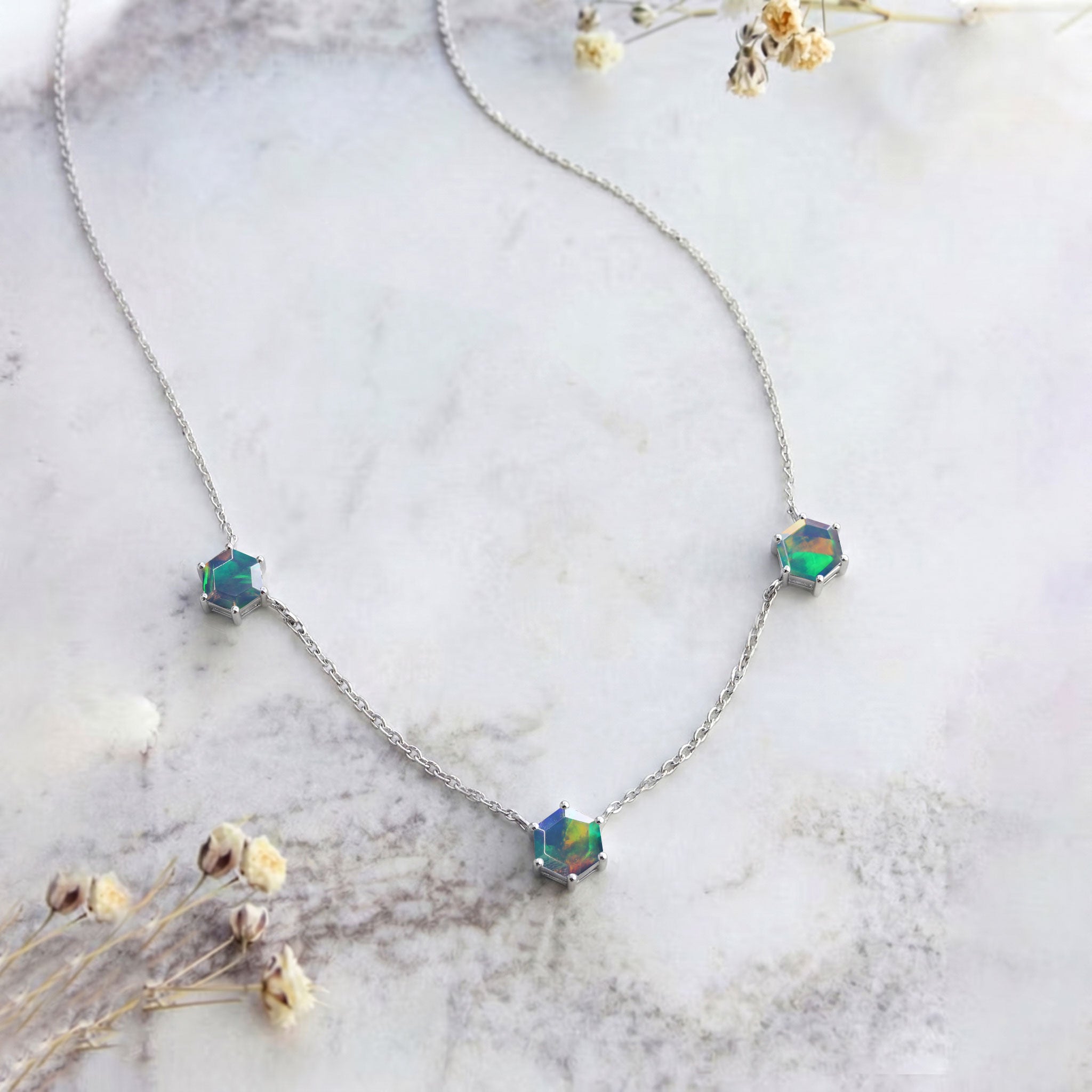 October birthstone black opal necklace for women with three stone gemstone station chain design
