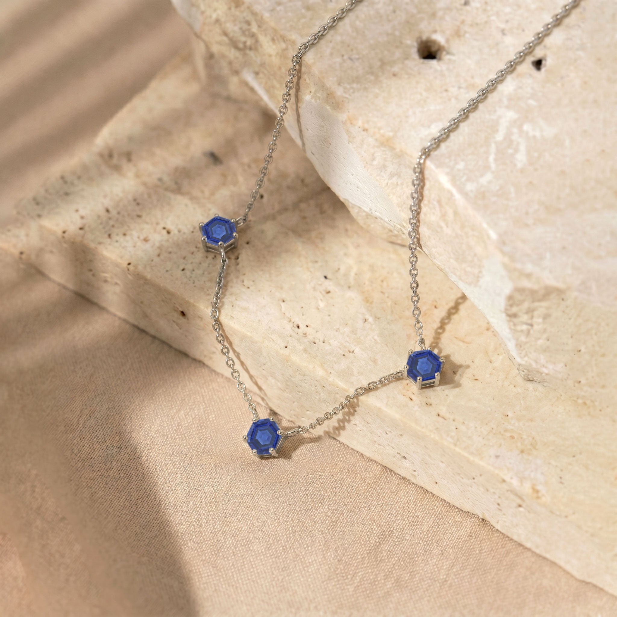 Blue sapphire station necklace with three 6mm hexagon cut sapphire gemstones and silver chain
