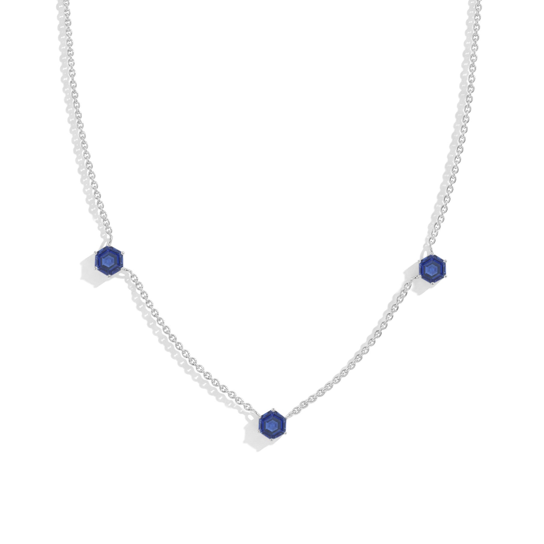 "Three stone blue sapphire station necklace featuring hexagon cut gemstones in 925 sterling silver
