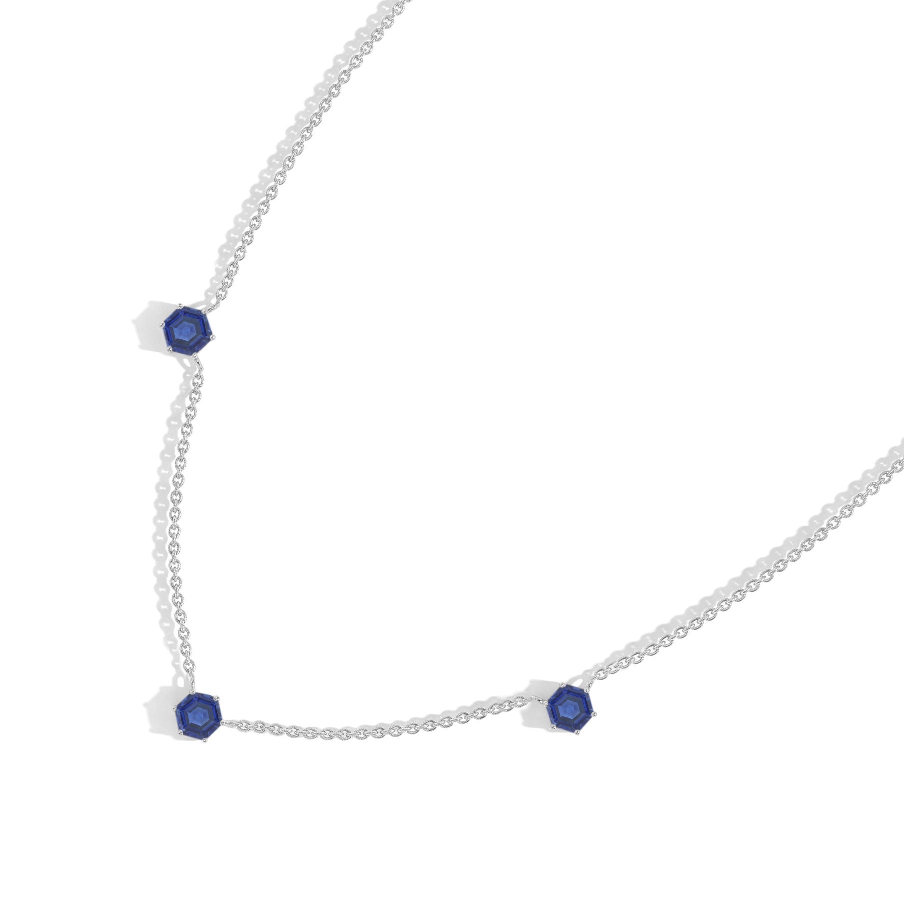 Handmade blue sapphire station necklace featuring elegant three gemstone arrangement

