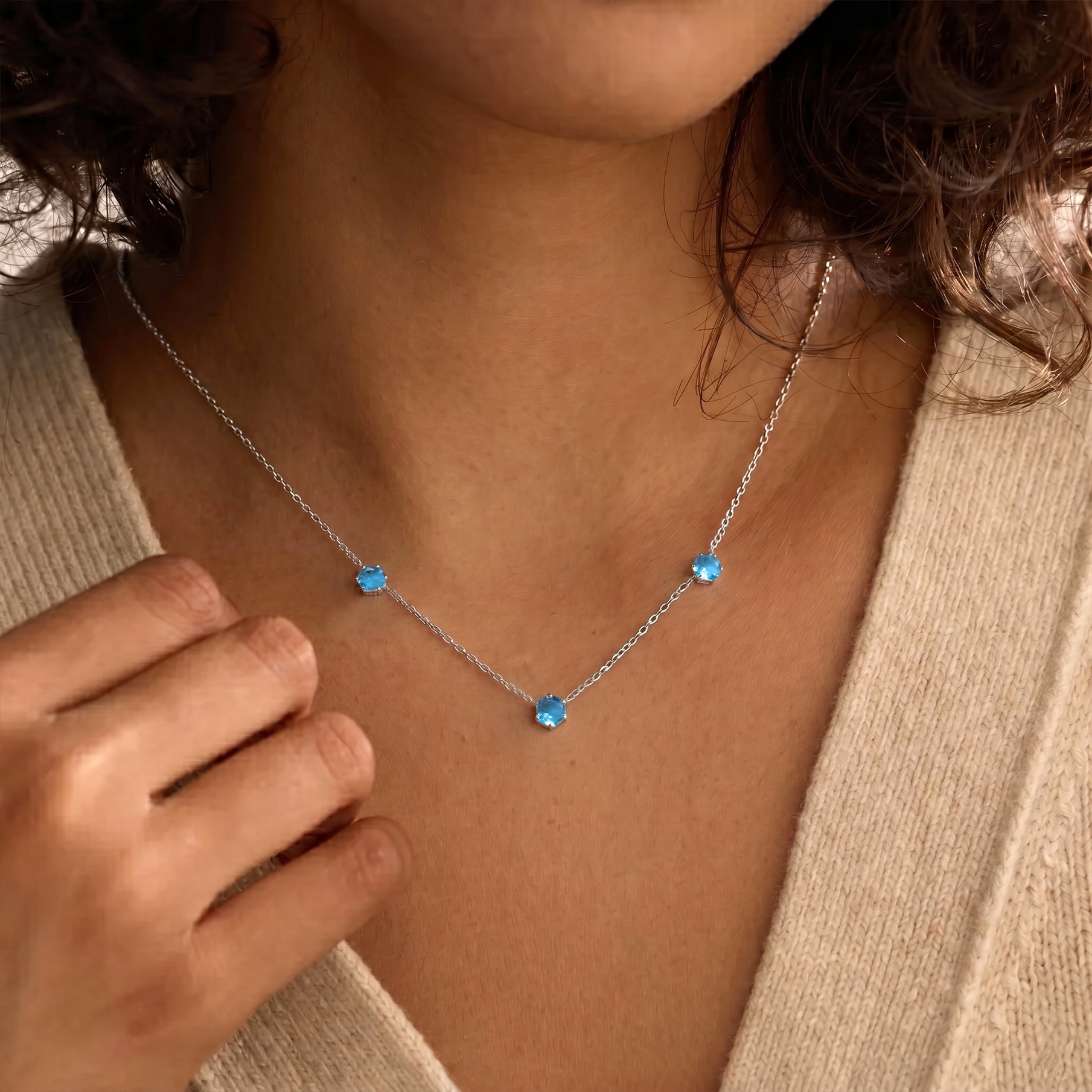 Elegant blue topaz three stone necklace with December birthstone jewelry design for women

