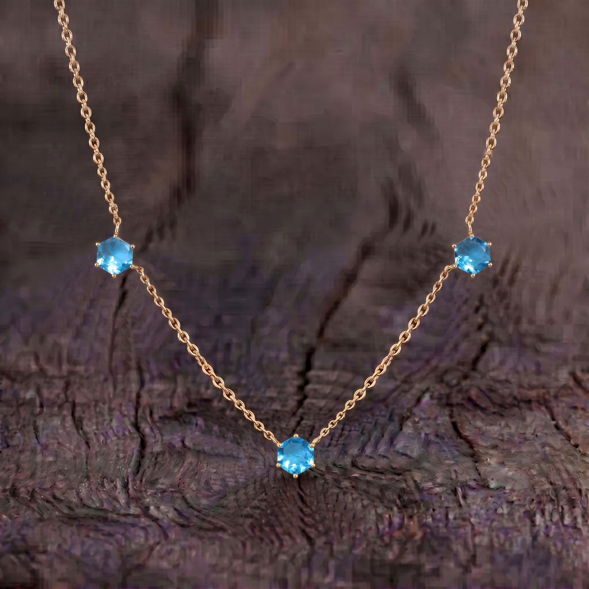 Blue topaz gemstone necklace for women with three stone hexagon cut jewelry details

