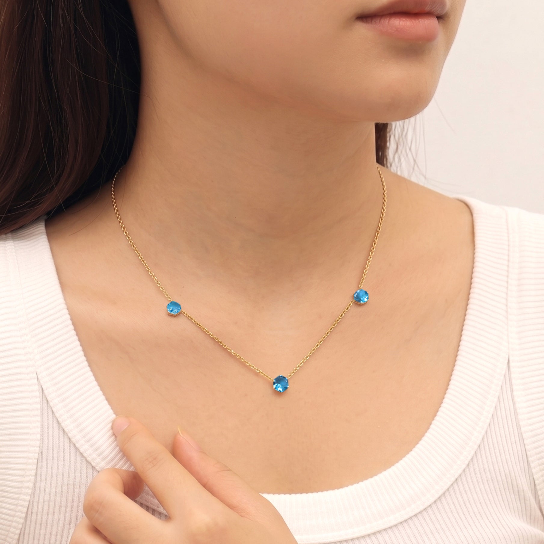 Fine jewelry blue topaz birthstone necklace with sterling silver craftsmanship
