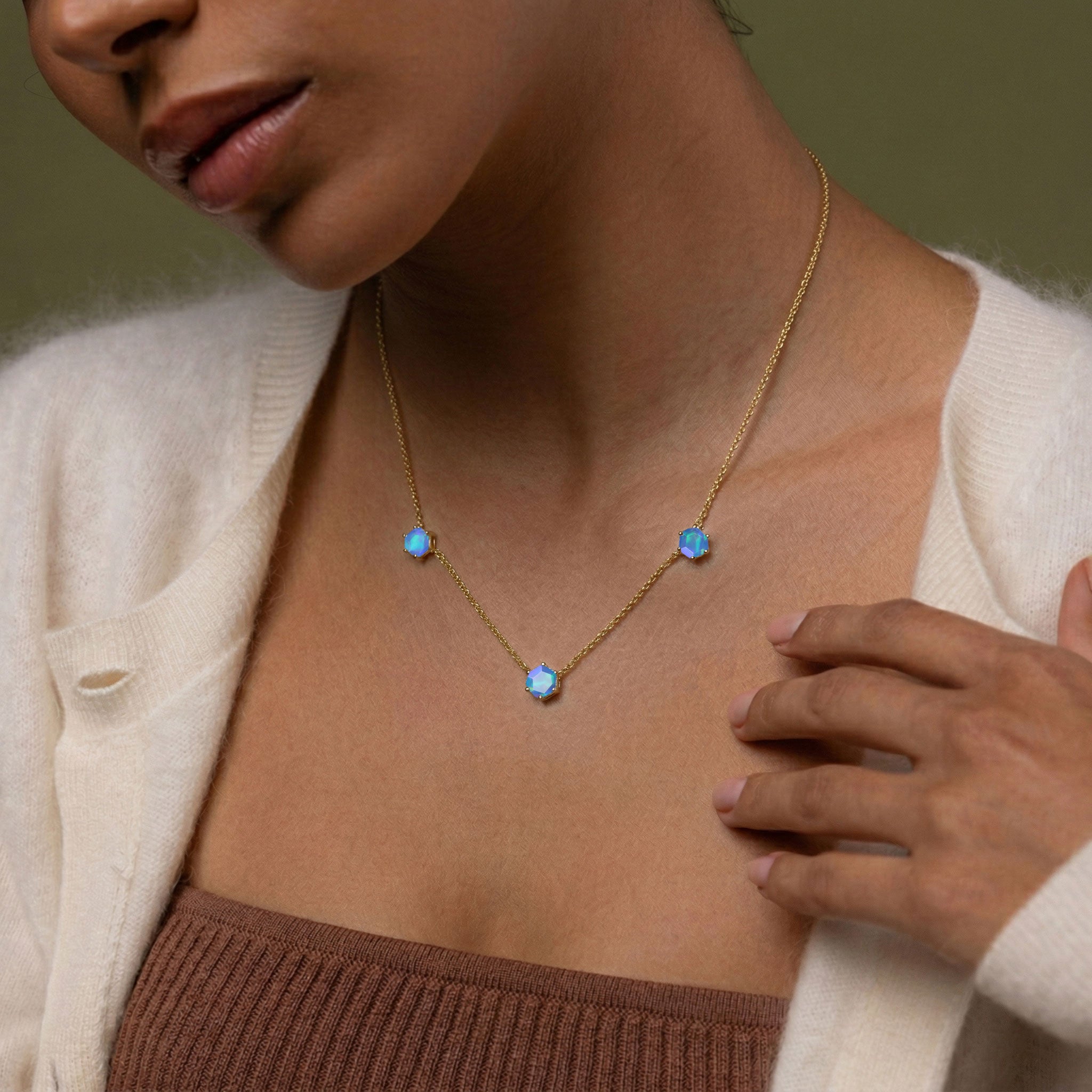 925 sterling silver blue opal necklace featuring modern three stone station design

