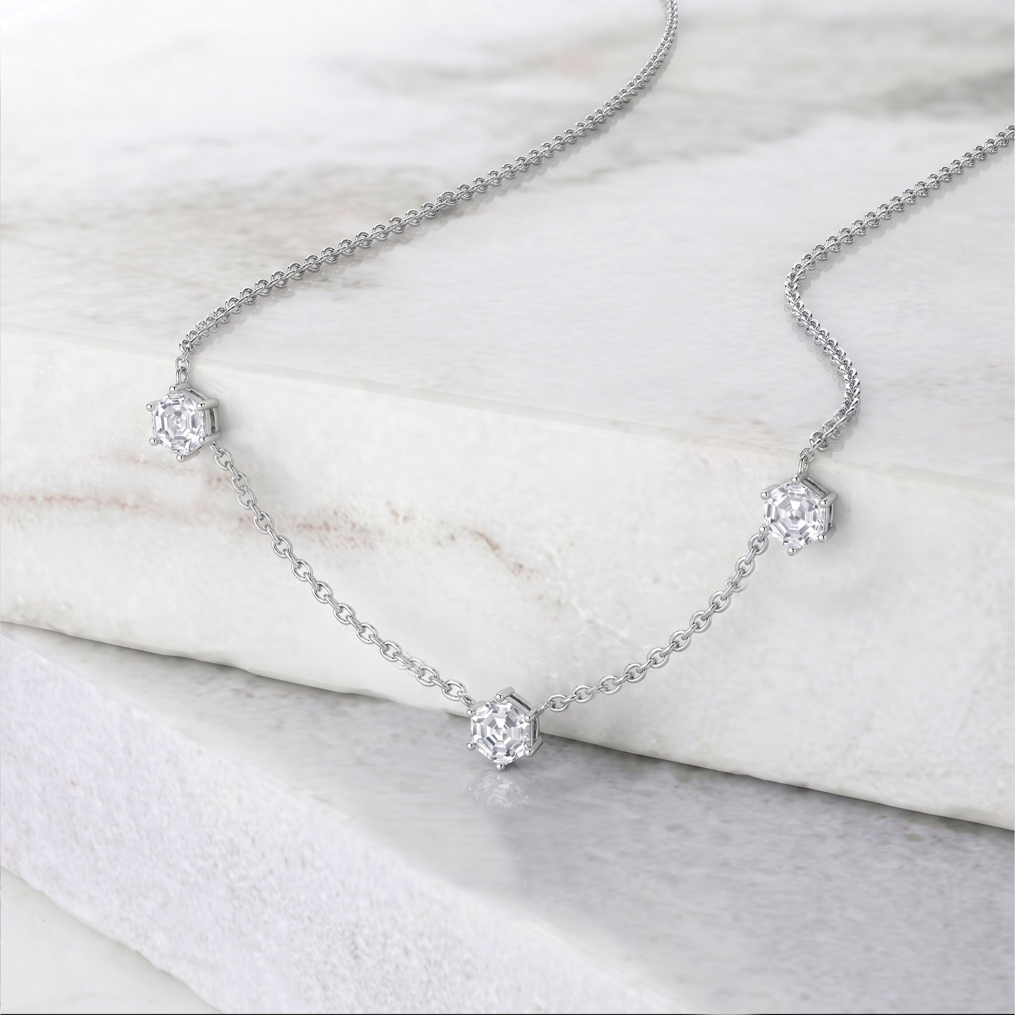Hexagon cut moissanite necklace with three sparkling gemstones and adjustable chain
