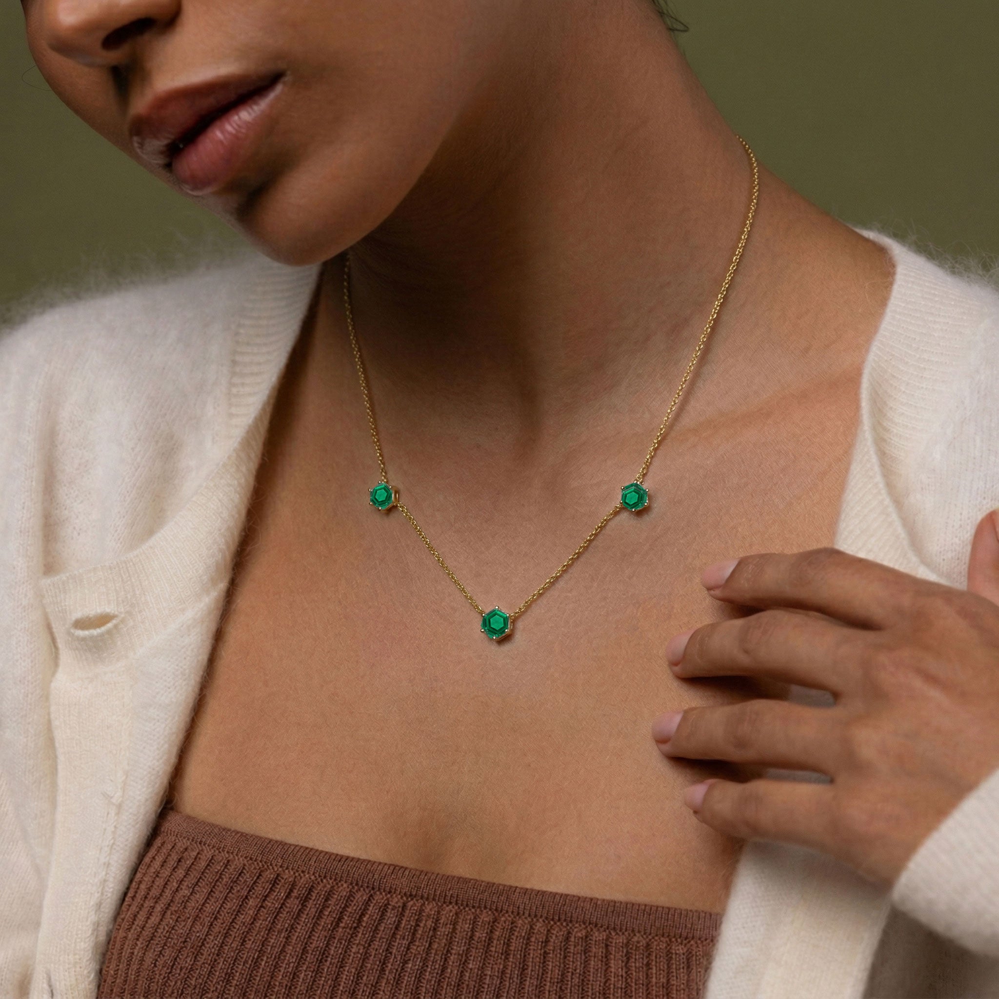 Beautiful emerald birthstone jewelry featuring a delicate adjustable chain necklace design
