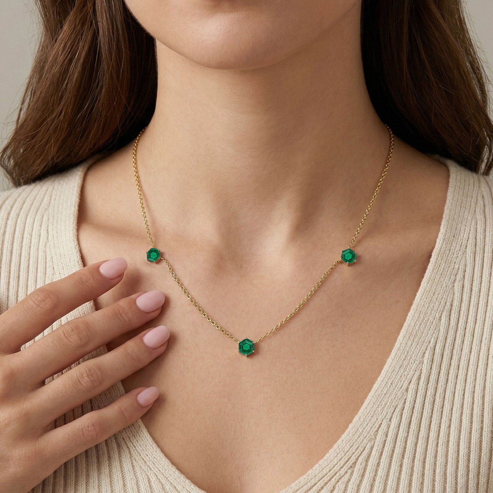 Luxury green gemstone necklace with hexagonal emerald stones and gold filled details
