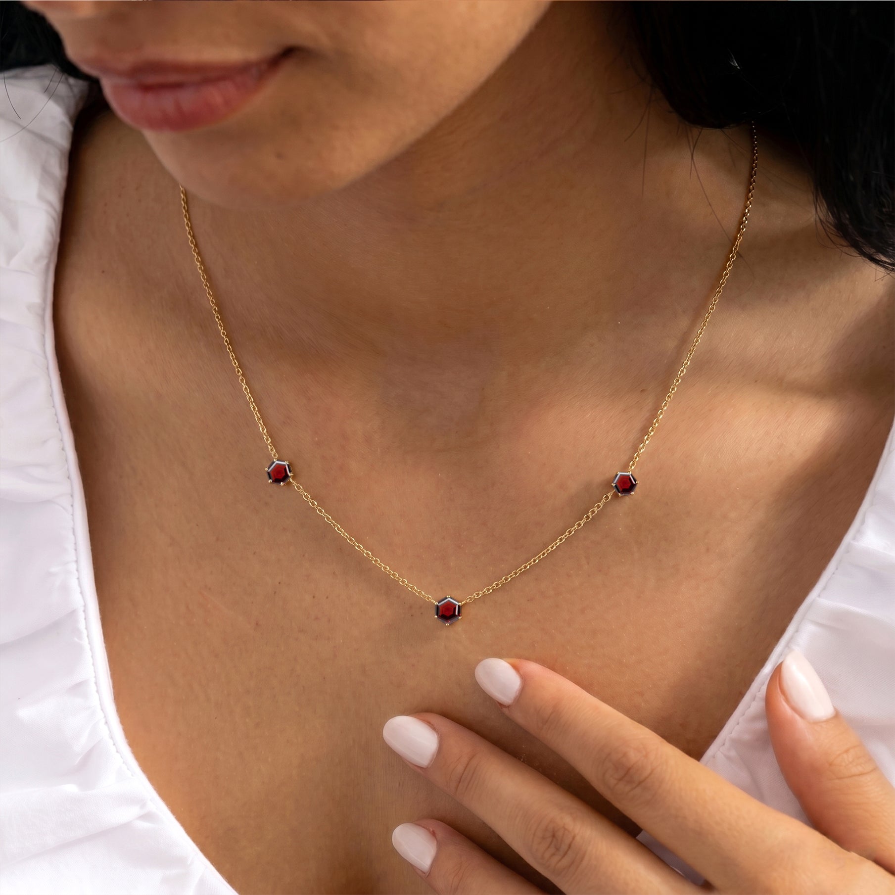 Fine jewelry January birthstone necklace featuring elegant garnet gemstones
