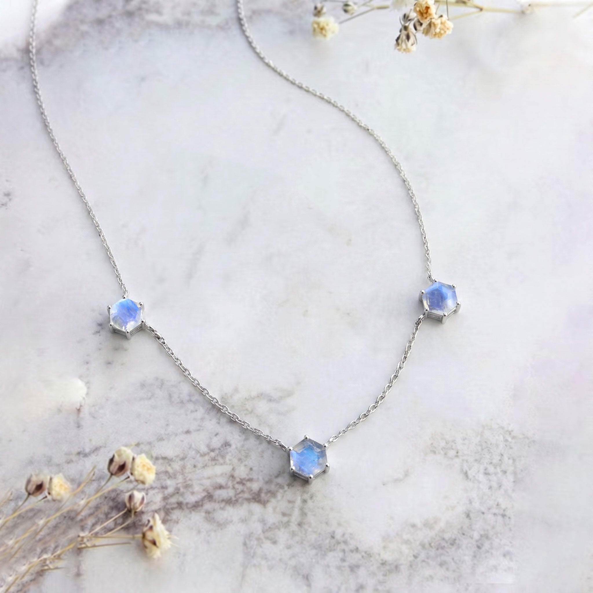 Sterling silver moonstone necklace featuring modern station necklace design

