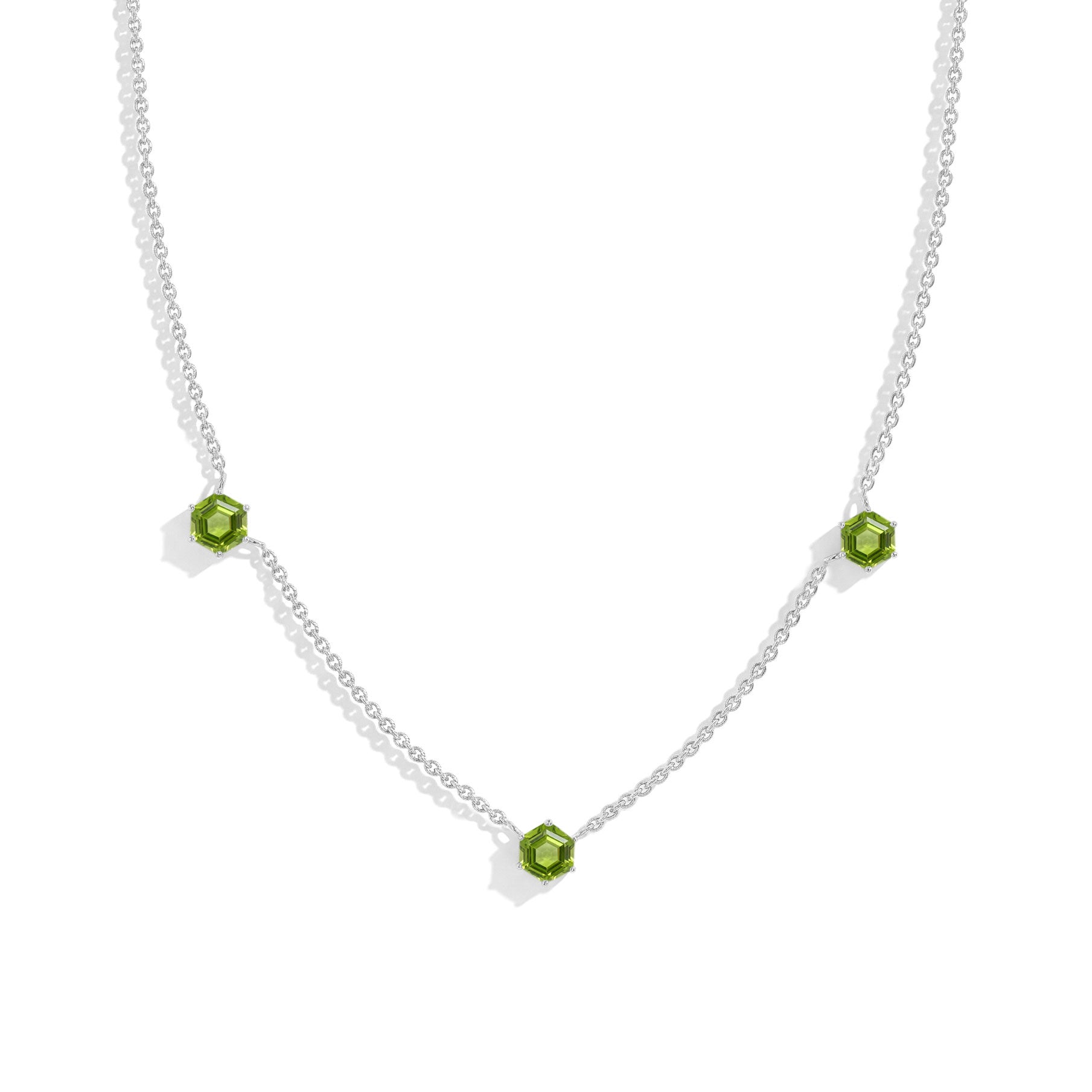 "Natural peridot three stone station necklace featuring hexagon cut gemstones
