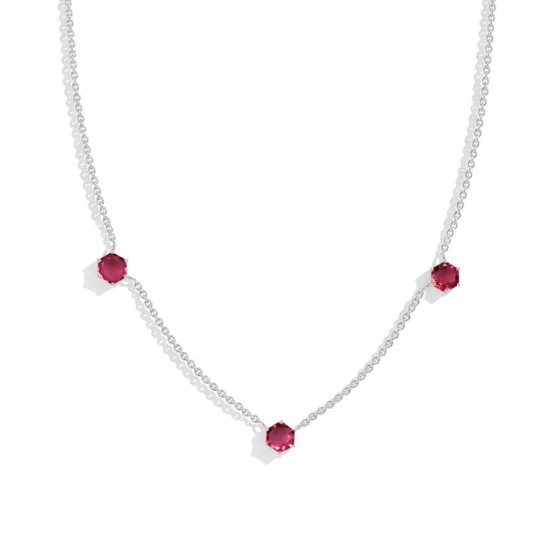"Three stone pink tourmaline station necklace featuring hexagon cut gemstones
