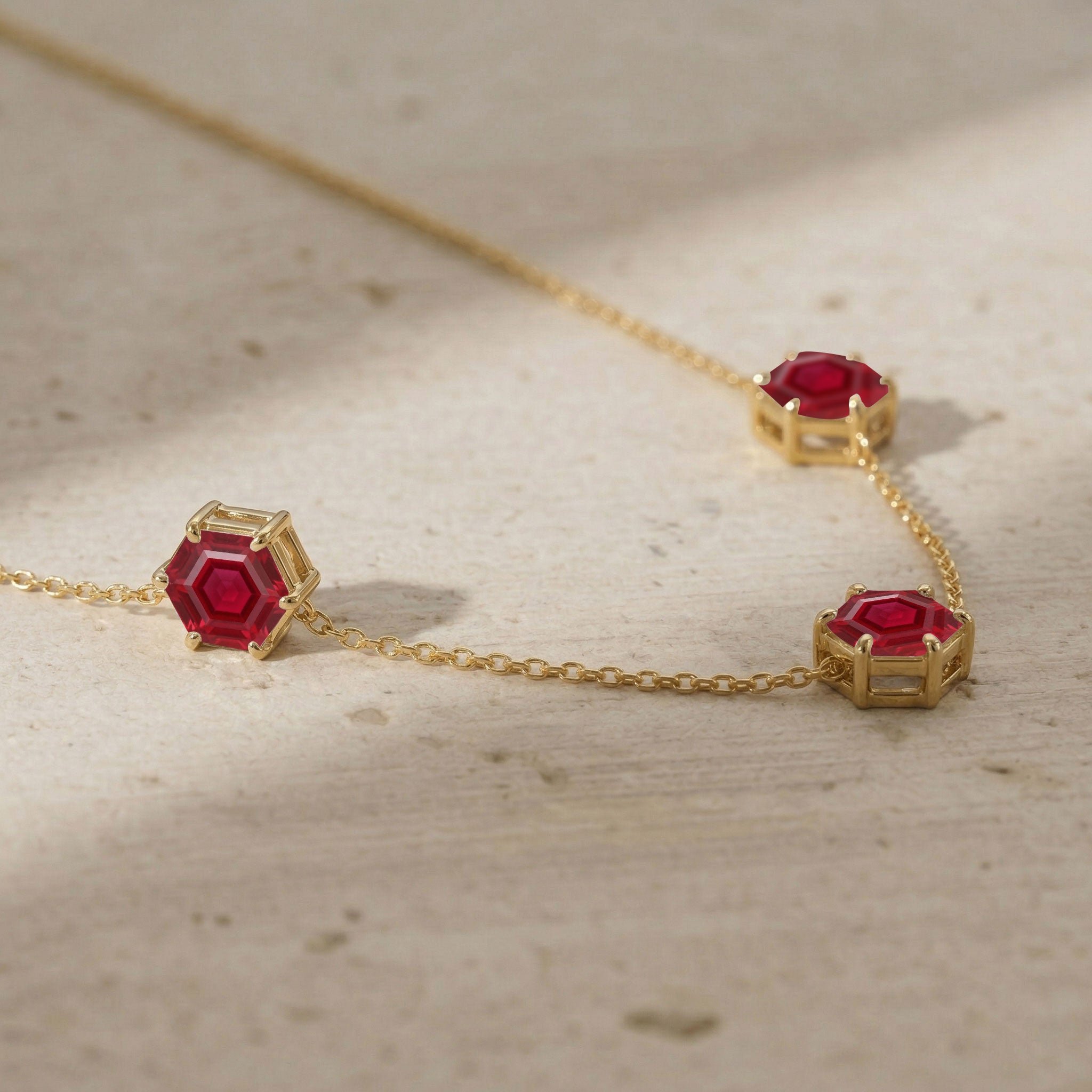 Red ruby gemstone necklace for women with three stone hexagon cut details
