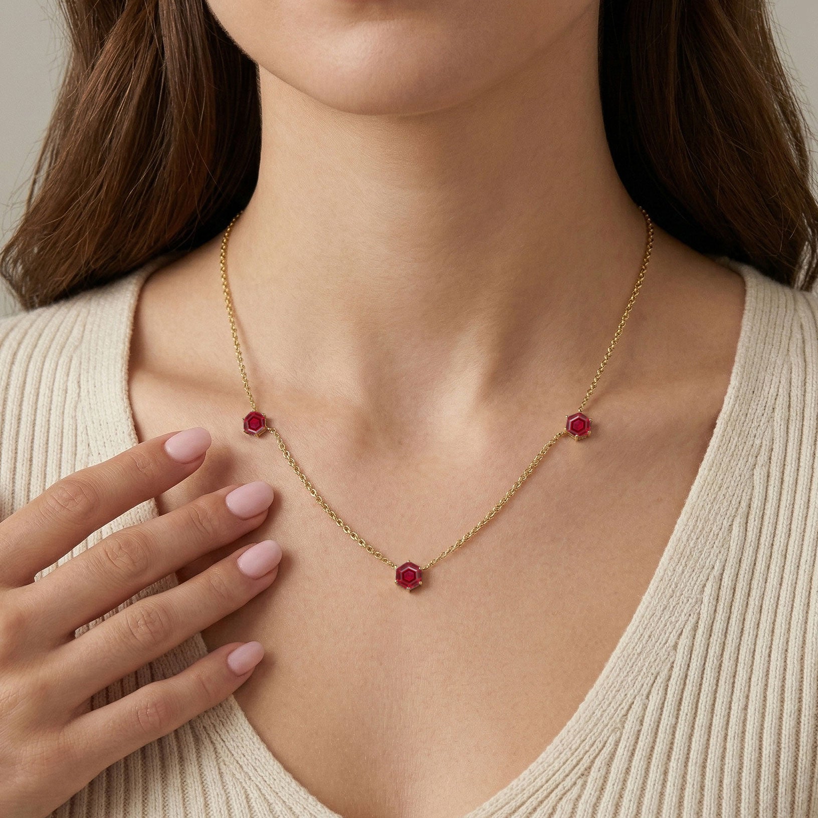 Sterling silver ruby necklace featuring modern station necklace design
