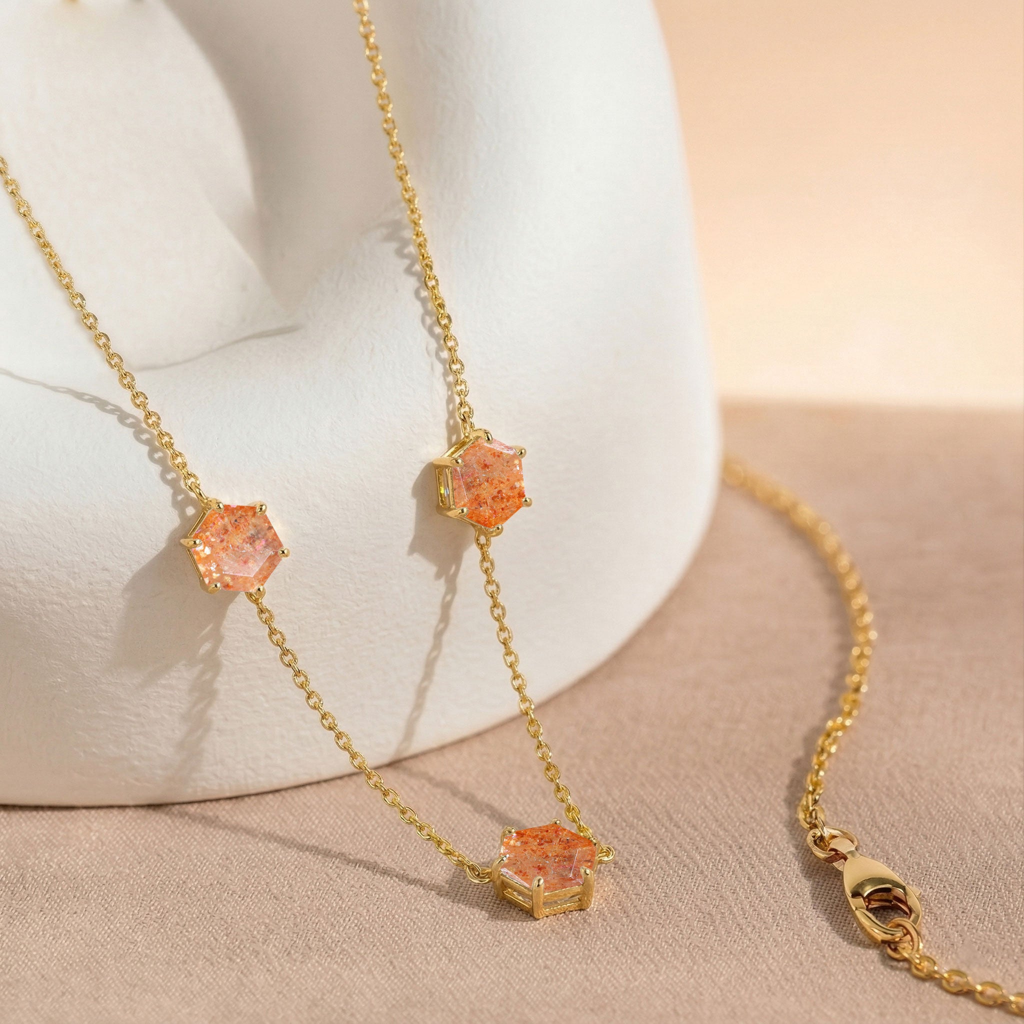 Sunstone station necklace with three 6mm hexagon cut gemstones and extender chain
