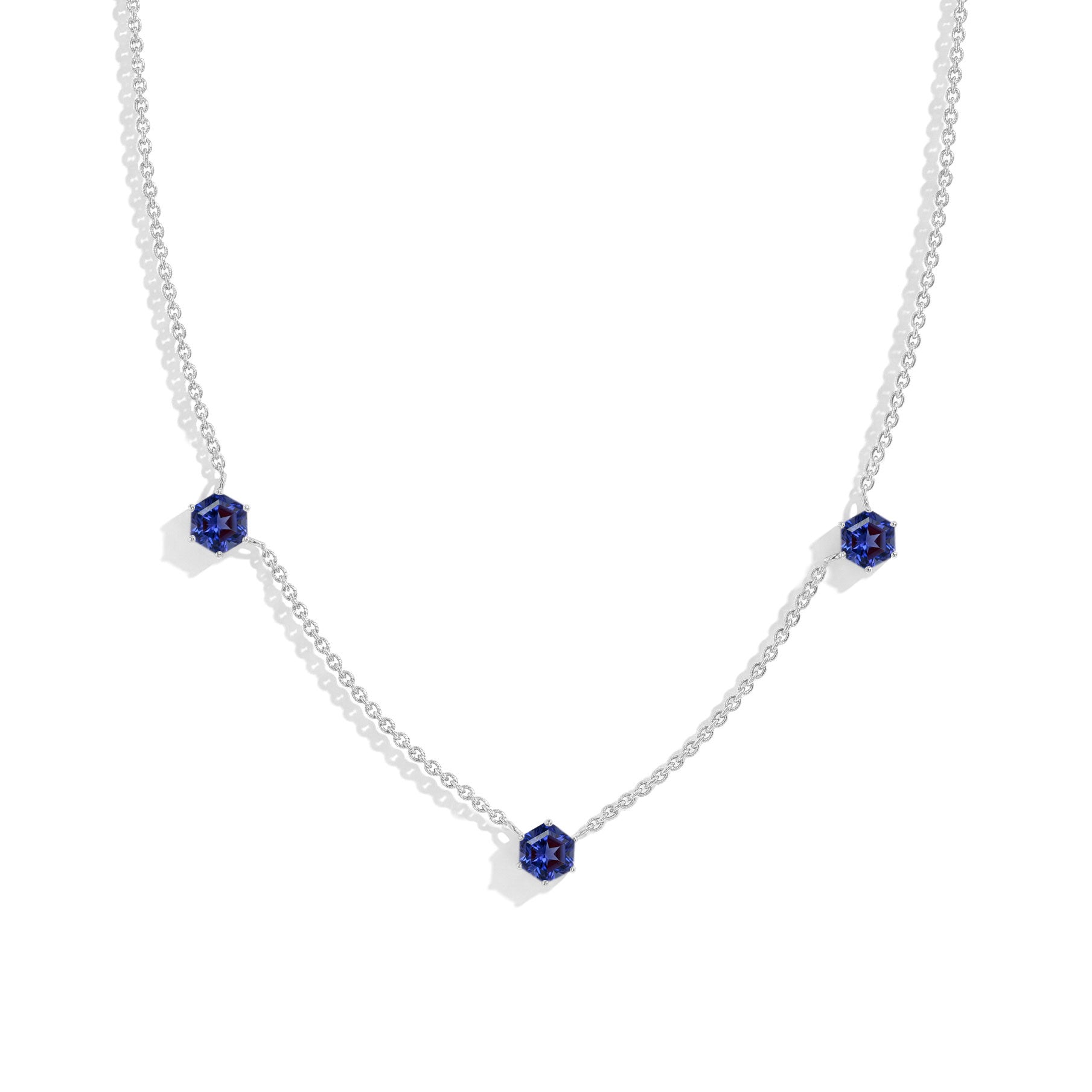 Three stone Tanzanite station necklace crafted in 925 sterling silver with yellow gold filled finish.
