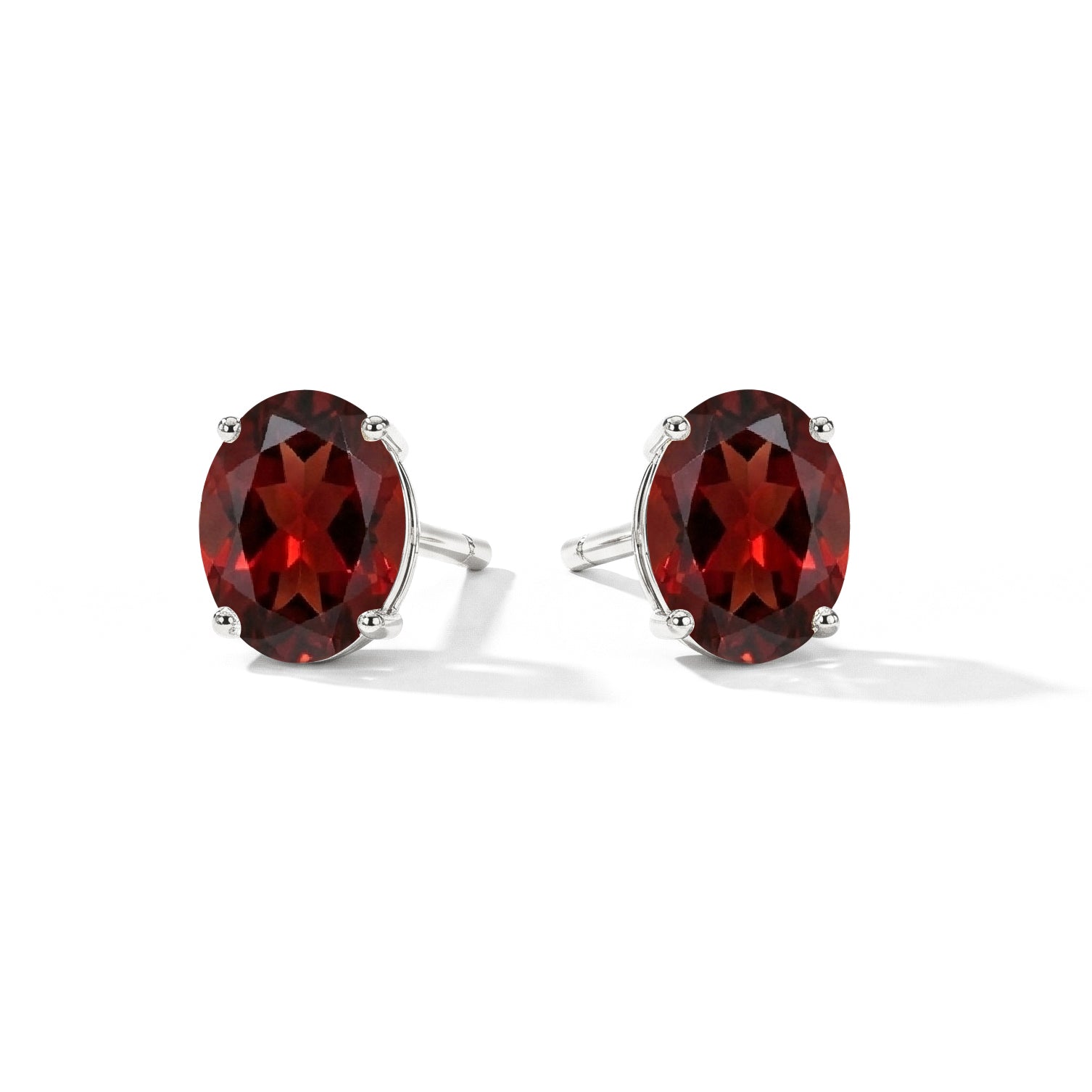 Oval garnet solitaire stud earrings elegant design