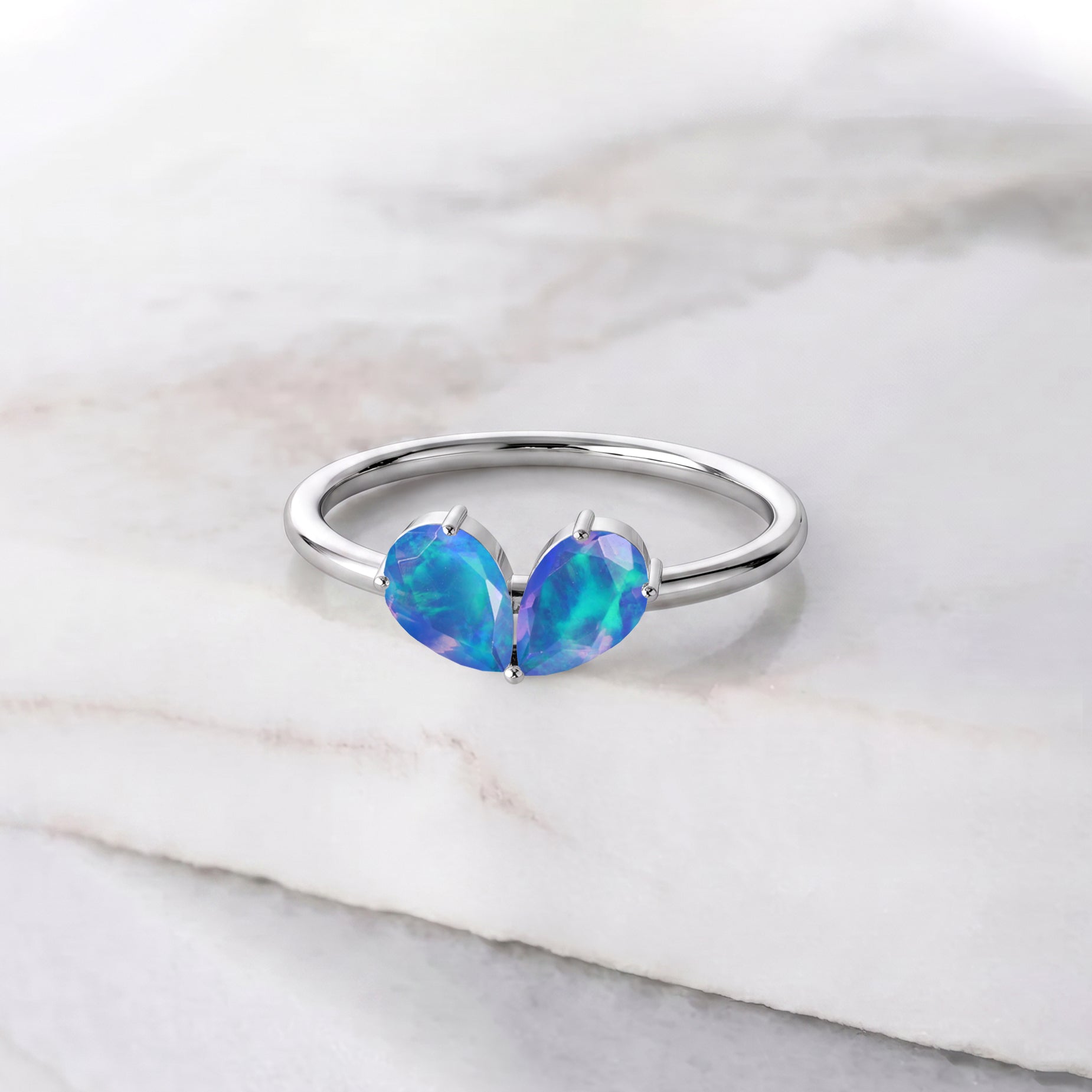 dainty ocean blue gemstone ring
blue opal ring on finger
modern minimalist jewelry
minimalist ring stack
blue gemstone ring for her
dainty jewelry stack
