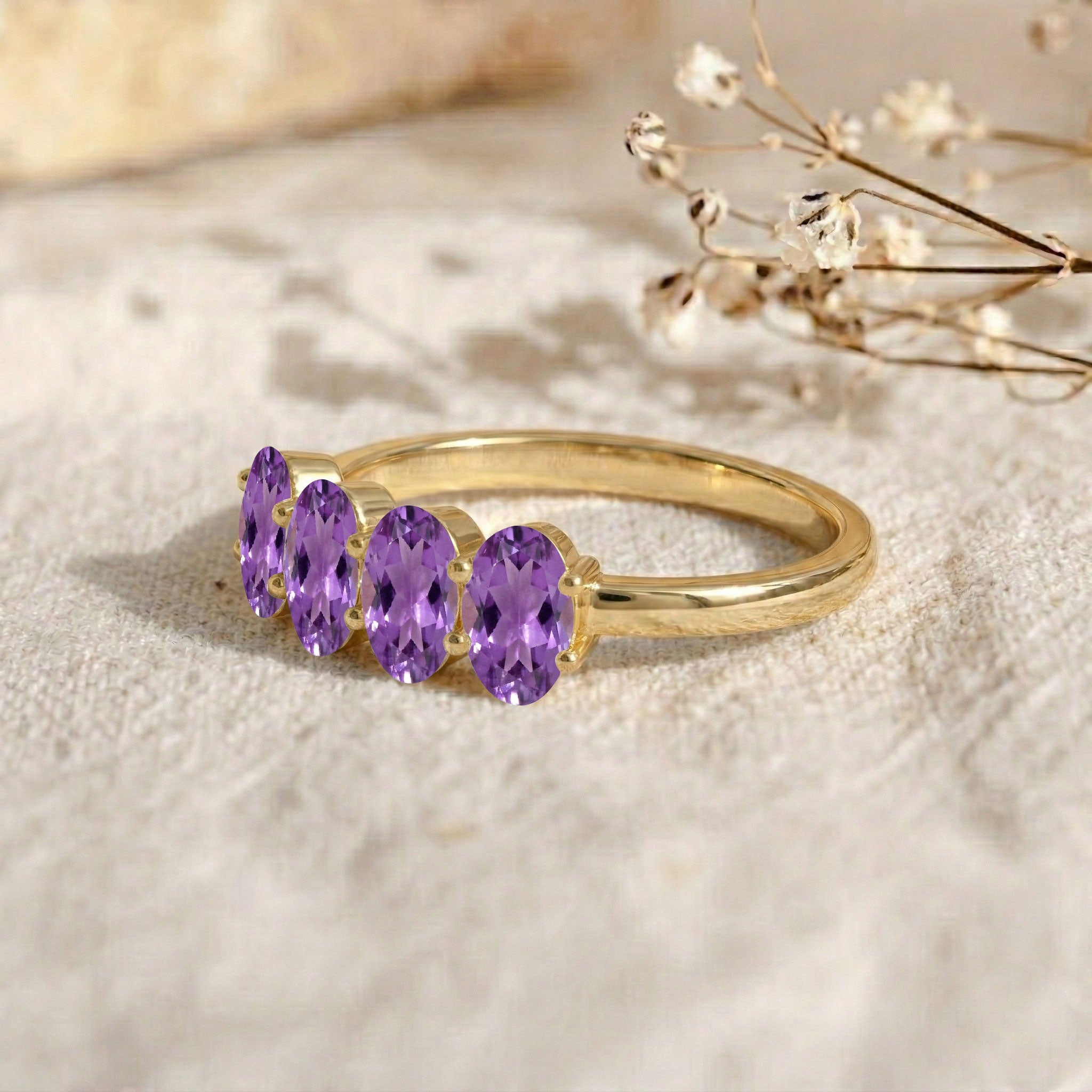 amethyst fashion ring, genuine gemstone jewelry, elegant oval gemstone design, polished band finish, luxury artisan ring, fine women's jewelry, contemporary stacking accessory, brilliant purple gemstones, anniversary jewelry gift, premium quality design