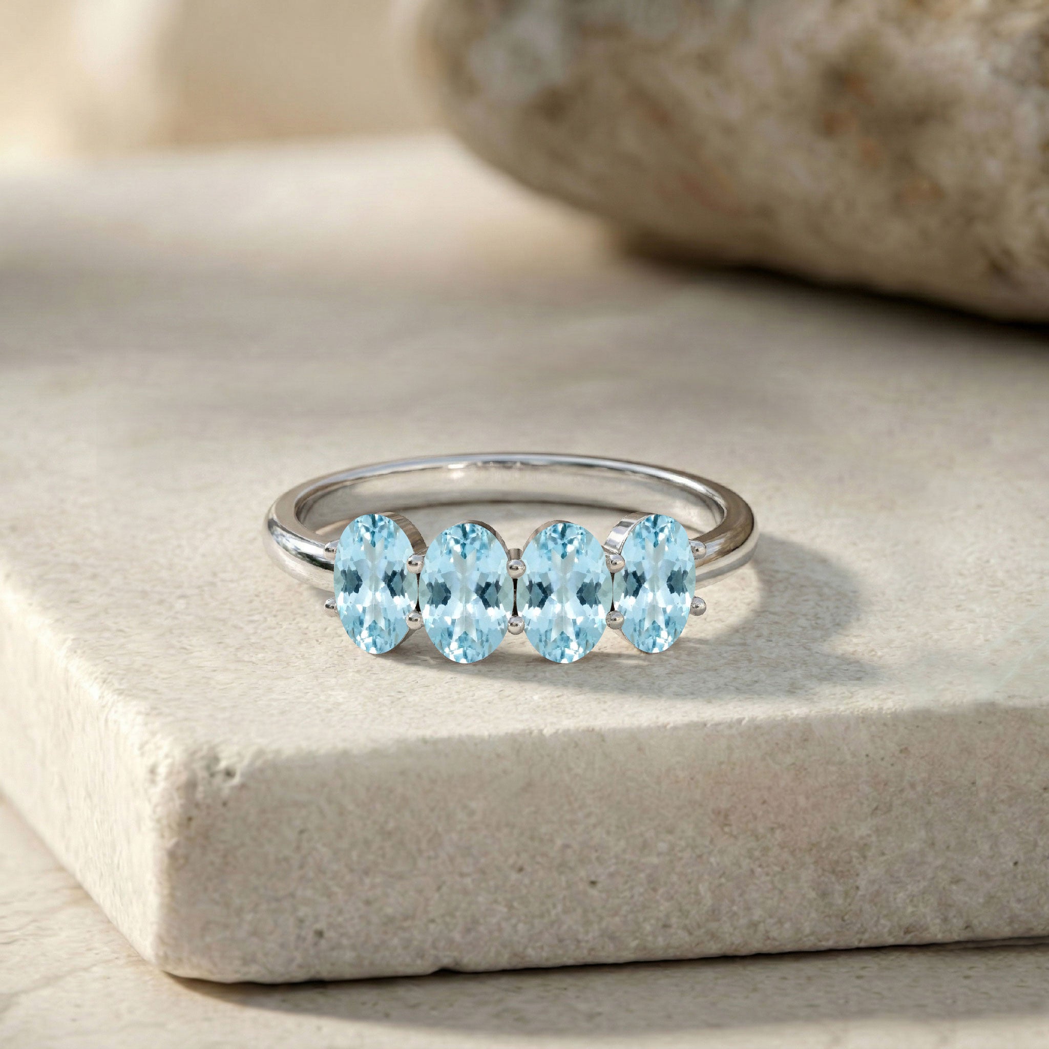 yellow gold filled ring, aquamarine gemstone jewelry, elegant gold band, oval blue stones, refined jewelry, anniversary jewelry, luxury accessory, stackable ring, women's gift, designer jewelry, polished gold finish, gemstone band