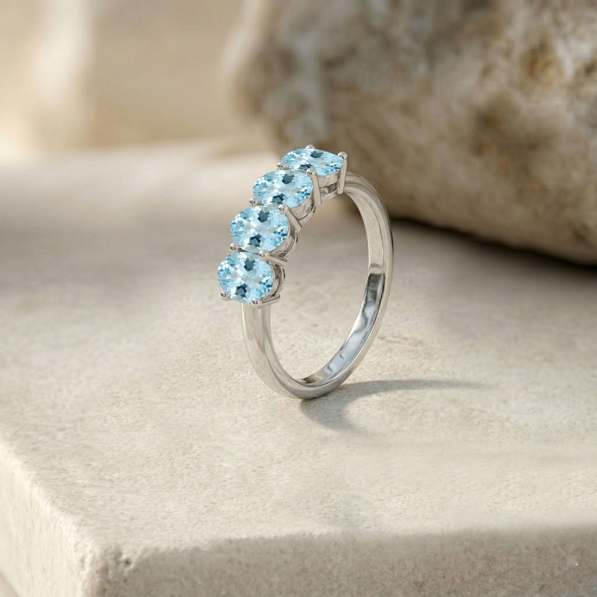 modern aquamarine jewelry, horizontal gemstone ring, polished band, oval cut aquamarine, fine jewelry, everyday luxury, feminine ring, stylish gemstone band, contemporary accessory, elegant jewelry gift, refined ring, premium craftsmanship