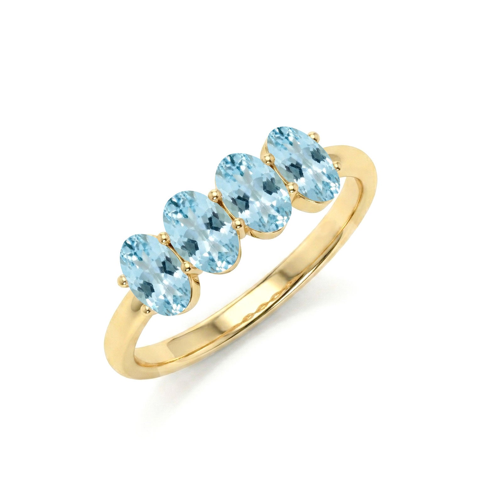 March birthstone jewelry, aquamarine gemstone ring, four gemstone band, oval cut ring, polished jewelry, bridal jewelry, promise ring, engagement style ring, feminine jewelry, timeless ring, everyday elegance, sophisticated accessory