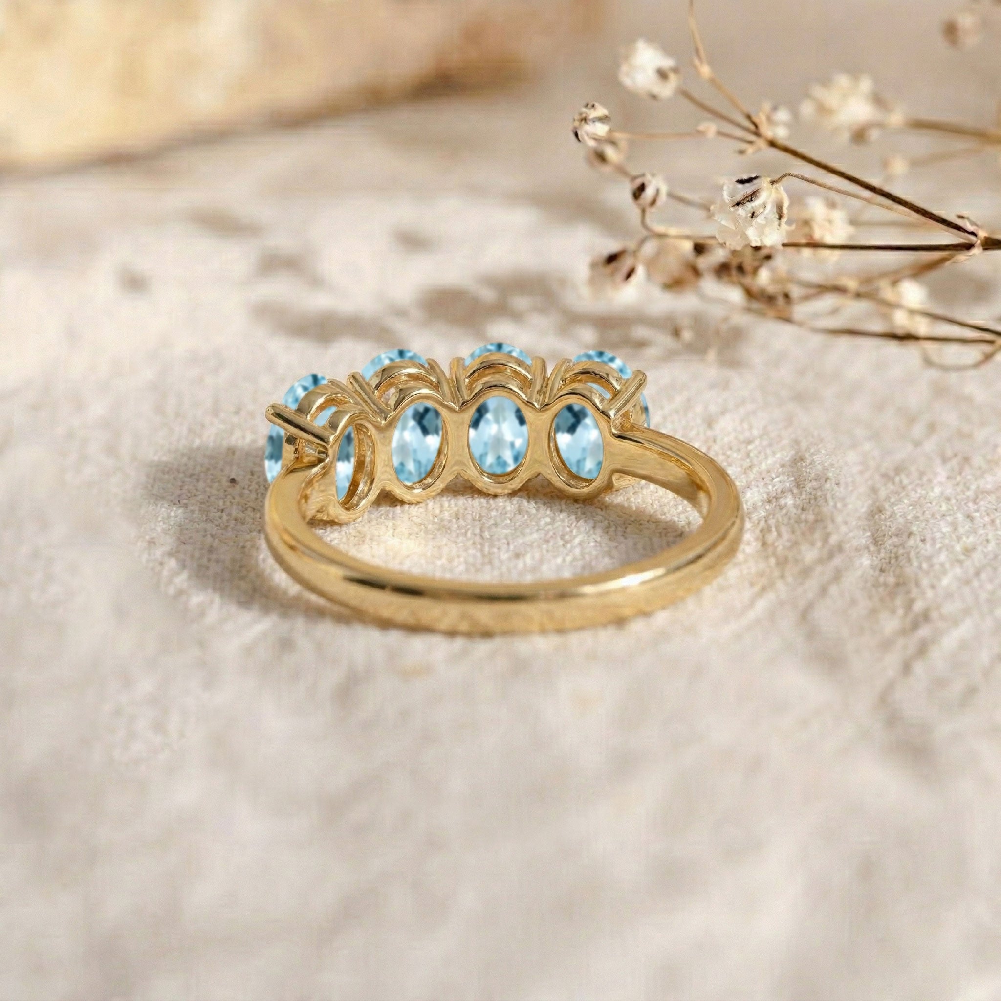 March birthstone ring, aquamarine gemstone band, elegant oval ring, blue crystal jewelry, delicate everyday ring, feminine fashion accessory, artisan made jewelry, luxury gift, modern stackable band, timeless elegance, fine gemstone jewelry, stylish ring