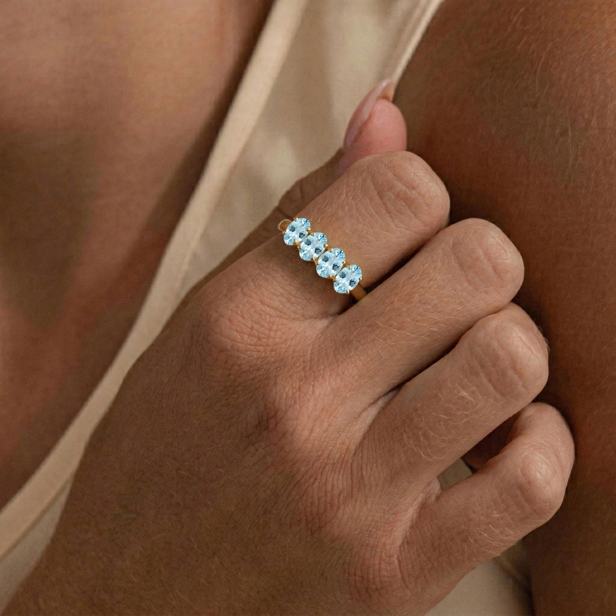 sterling silver aquamarine band, polished silver ring, four oval stones, blue gemstone jewelry, March birthday gift, delicate ring, everyday wear, minimalist band, handcrafted ring, timeless jewelry, elegant silver accessory, fashion ring