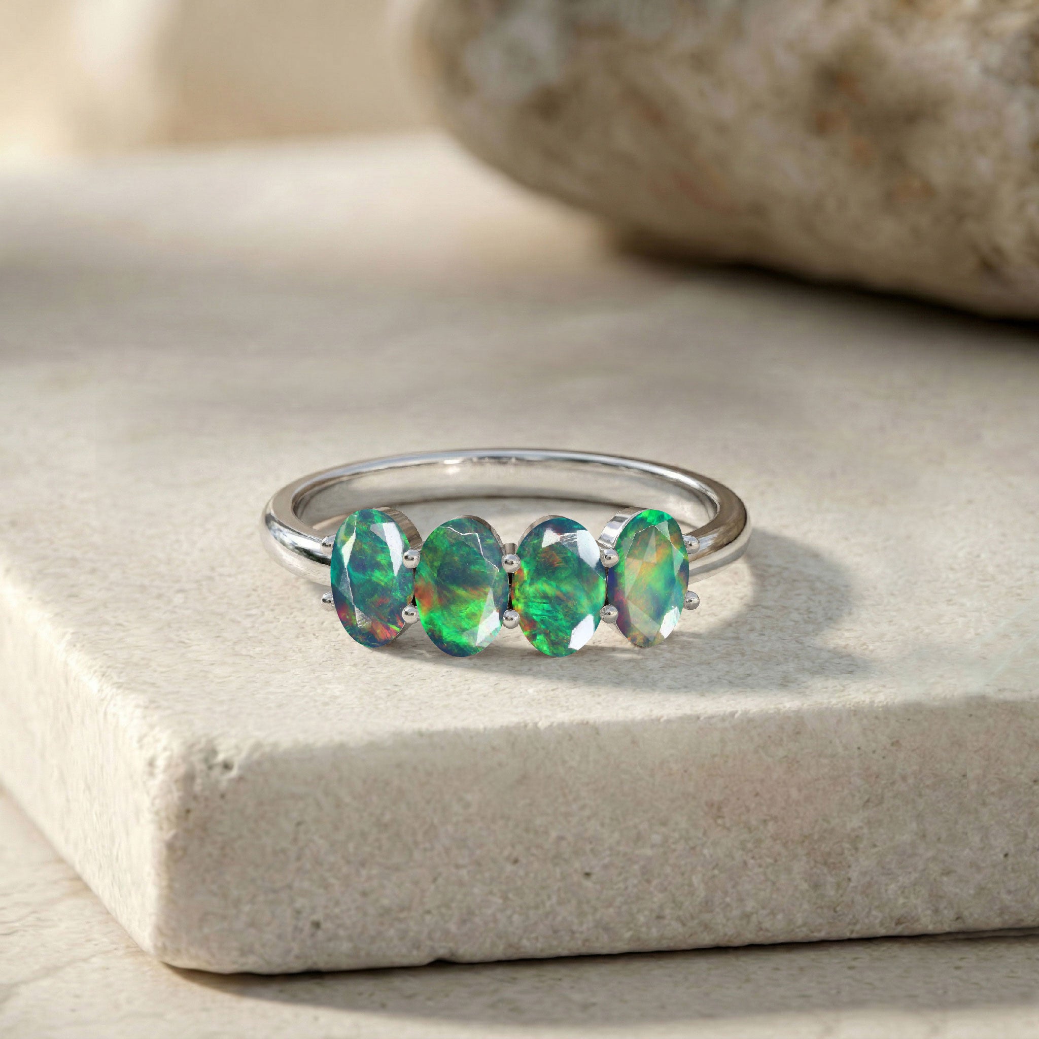 genuine black opal anniversary ring, faceted oval gemstone jewelry, stylish women's ring, handcrafted luxury accessory, elegant fine jewelry, October gemstone gift, colorful natural opal, modern minimalist ring, stackable fashion jewelry, premium artisan craftsmanship, timeless gemstone elegance, unique ring design