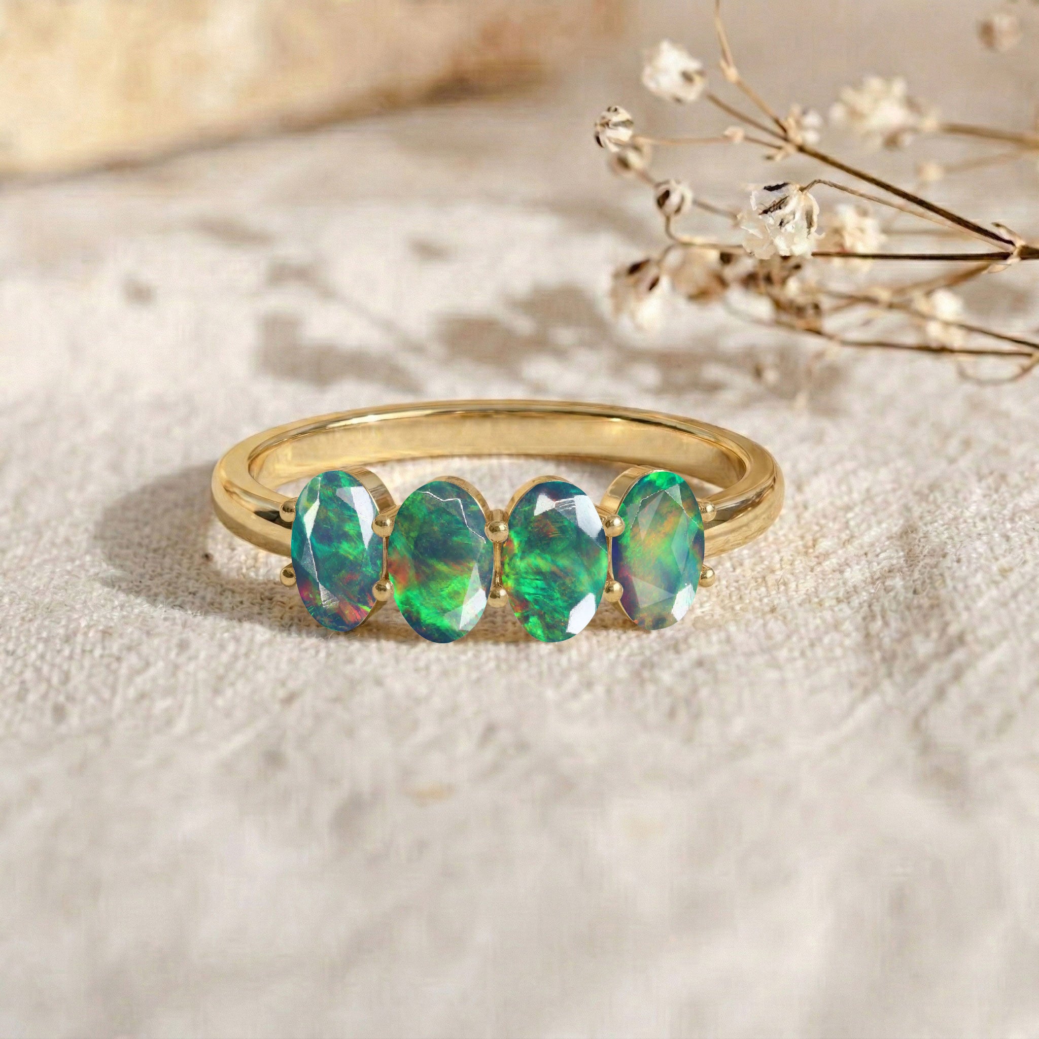 gold filled gemstone ring, natural black opal jewelry, four oval gemstone band, luxurious gift for wife, timeless jewelry design, October birthstone jewelry, handcrafted fine ring, elegant minimalist accessory, colorful opal flashes, refined fashion jewelry, everyday luxury ring, modern gemstone band