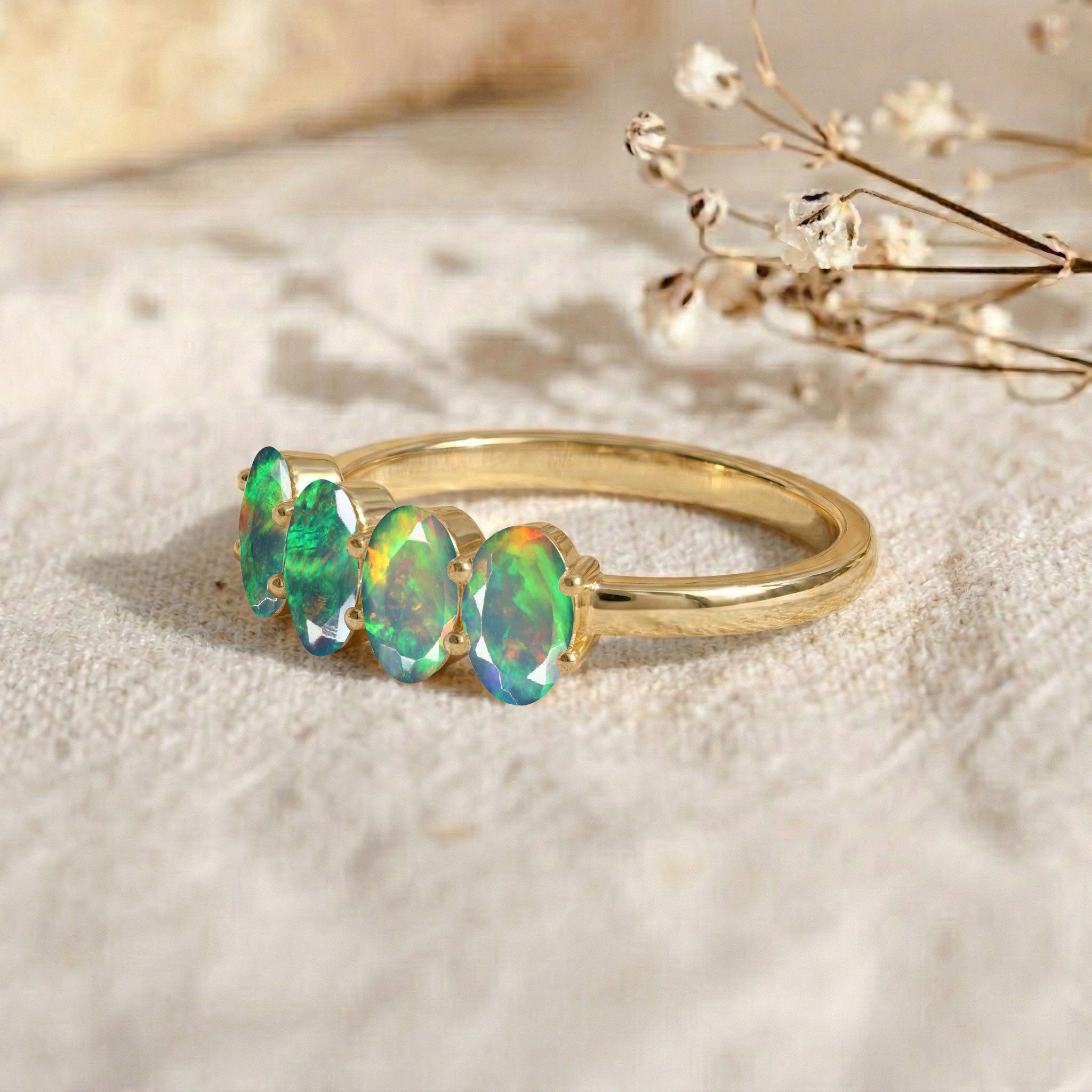 gold filled luxury jewelry, natural opal gemstone ring, four stone oval band, elegant gift for women, artisan crafted ring, premium jewelry accessory, colorful fire opal flashes, October birthstone keepsake, modern minimalist elegance, refined gemstone design, sophisticated luxury fashion, timeless jewelry style